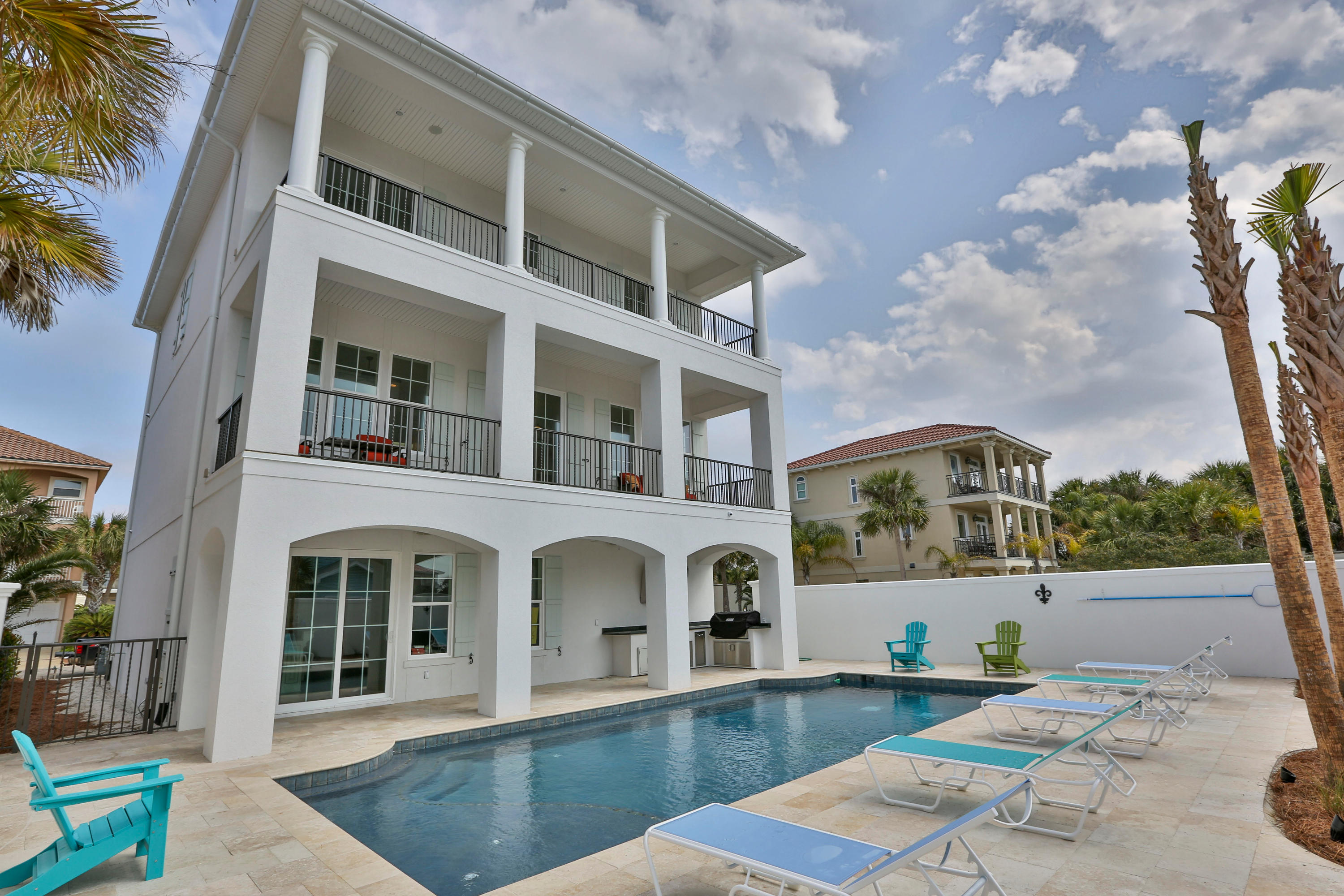 Are you tired of seeing nice homes that you still have to cross the street to get to the beach? Are you looking for a powerhouse rental that's turnkey ready and completely stands out from the rest? Then look no further. This must-see 5 bedroom custom beach house is conveniently located just steps away from the beautiful sugar white sandy beaches and did over $165,000 in 2015 gross rentals! Here are just a few of the many highlights of Magnolia Sands: Reclaimed Antique Hard Pine floors throughout, elevator, surround sound, antique wrought iron entry door, golf cart garage with additional storage, Impact resistant windows, 10 ft ceilings, Carrara Marble counter tops, media/theater room with surround and projection system, wet bar with wine cooler and ice maker, plantation shutter