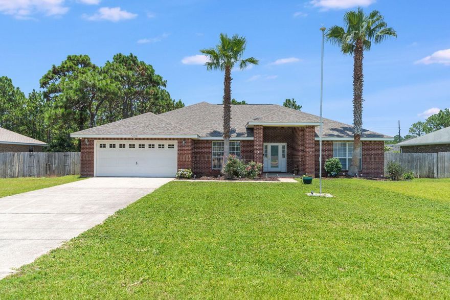 Large 3 bedroom/2 bath on a very large lot in Holly by the Sea! The home is very clean and well maintained with a large open concept living area. The living area has vaulted ceilings, laminate flooring, and fireplace. There is a flex room that makes a perfect office. The primary bedroom is spacious. Connected is a bathroom with two walk-in closets, double vanity, garden tub and walk-in shower. The back yard is vast and flat with a large shed that has power . The home is equipped with an ADT security system and Ring doorbell. Full 2 car garage attached with convenient shelving. This home is a short distance away from Holly by the Sea Recreation Center and Navarre Beach! Roof 2021. AC 2016.