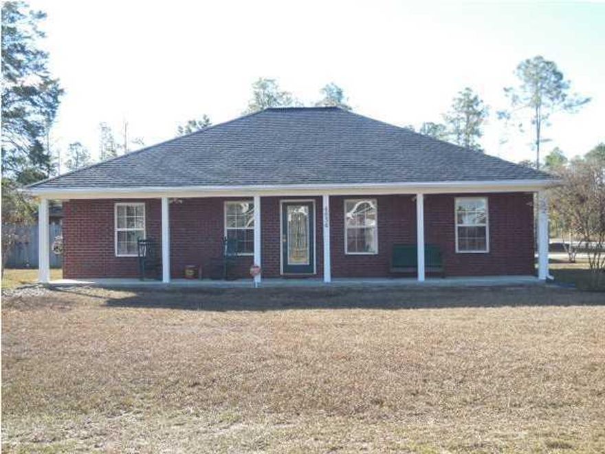 YOU WILL NOT FIND ANOTHER HOME OF THIS QUALITY AND PRICE ANYWHERE!Situated just off Hwy 90 E, 9 miles from Crestview & 2 miles to Hwy 285--you are still close to everything!! Lots of upgrades and extras that will certainly impress you! All brick custom-built 3br/2b home on corner lot with large front porch and a back patio which has been enclosed (heated & cooled) and now included in square footage. Step inside the family room and you will be drawn to the custom corner brick fireplace with built-in enclosure for your TV, remotes, cords & satellite box etc. The dining area & kitchen are ahead with double French doors leading to Florida room (added in 2012). To the right of family room will be the additional bedrooms. The kitchen is centered between the master bedroom and large laundry room w/pantry. The kitchen is equipped with top of the line stainless gas stove w/griddle & microwave purchased in early 2012. Master bedroom has tray ceiling with crown & rope lighting. Master bath has large shower, double vanity and walk-in closet. Pergo flooring in dining area, tile in kitchen, laundry & baths, new stain master carpet installed in 2013 in family room & bedrooms, Lenox 3 1/2 Ton HVAC system installed in Oct, 2012 & even new A/C duct work in 2011. Original insulation was R-38 and seller added 19'' more in 2012. There is cellulose in exterior & interior walls, you'll find attic fans in house, 27x25 garage & 15'x 11'5 workshop. Tongue & groove cypress was used for walls & ceiling in Florida room and two 9'impact graded sliding doors installed on side & back-plenty of light!! Large 27x25 Brick-front two car garage w/carriage style garage doors, extra side entrance from house, wired for 220, lots of floored storage above, attic fans in garage, house & workshop. Mosaic Back splash in Kitchen, Updated laundry room with laundry folding table, hanging rack and back splash, Additional finished bonus room with tongue and groove pine walls. Patio connecting house and garage, ADT home security system and flower beds in front of house. Walking around back to workshop you will notice the additional outside patio area behind garage. The workshop or MAN CAVE(w/power & window a/c) has regular door entry & a ramp leading to single garage door. There is so much to this home for EVERYONE and more than can be described so you have to see for yourself! DEFINITELY GETTING MORE FOR YOUR MONEY ON THIS ONE! MAKE YOUR APPOINTMENT TODAY!!