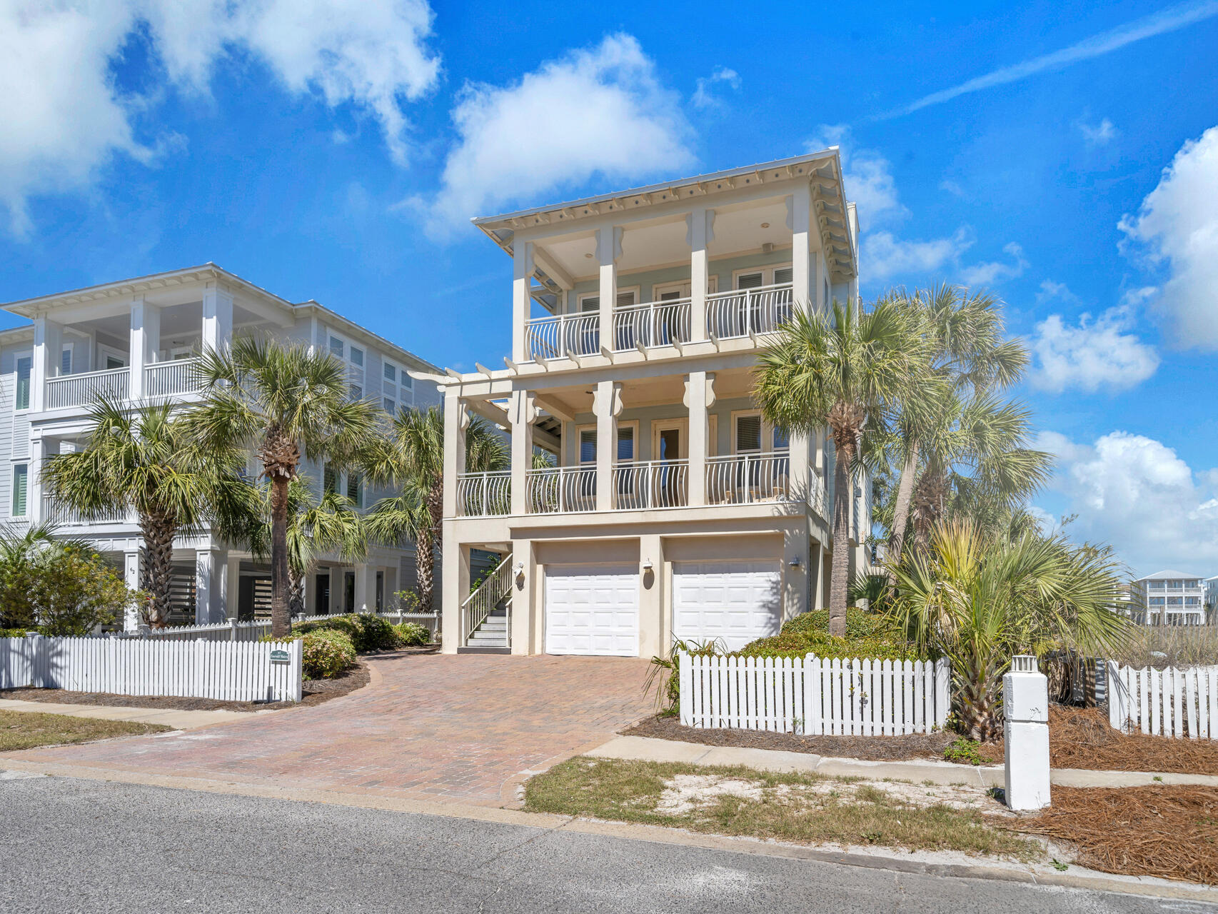 Located in the serene Holiday Isle neighborhood of Destin Pointe, 64 Lands End Drive is a distinguished residence offering both luxury and comfort. This 3-bedroom, 3 full bathrooms plus 2 half baths spans just over 3,000 square feet across 3 levels which is easily accessible via elevator. This property boasts a spacious layout designed for both relaxation and entertainment. The main living areas feature two inviting great rooms, each equipped with cozy fireplaces, providing warmth and ambiance in addition to expansive porches that showcase views of Lake Christina, Destin Pass/bridge, and the Gulf! The master suite serves as a private retreat, featuring a comfortable sitting area and a deluxe master bath. Just beyond the garage space on the first level, you will find a washer/dryer, toilet, and sink making for a very easy clean up when coming inside from outdoor activities! A massive sand pit/play area sits next to the grill, this will give the children great entertainment while the cooking is underway. Situated just steps away from the beach and the brand new elevated community pool overlooking the Gulf, you do not want to miss this home! Despite its tranquil setting, the property remains conveniently close to local amenities, ensuring a balanced lifestyle! Additional amenities behind gated Destin Pointe are two lighted tennis courts, shuffleboard, and walking paths. For those seeking a luxurious piece of real estate in Destin, 64 Lands End Drive presents an exceptional opportunity.