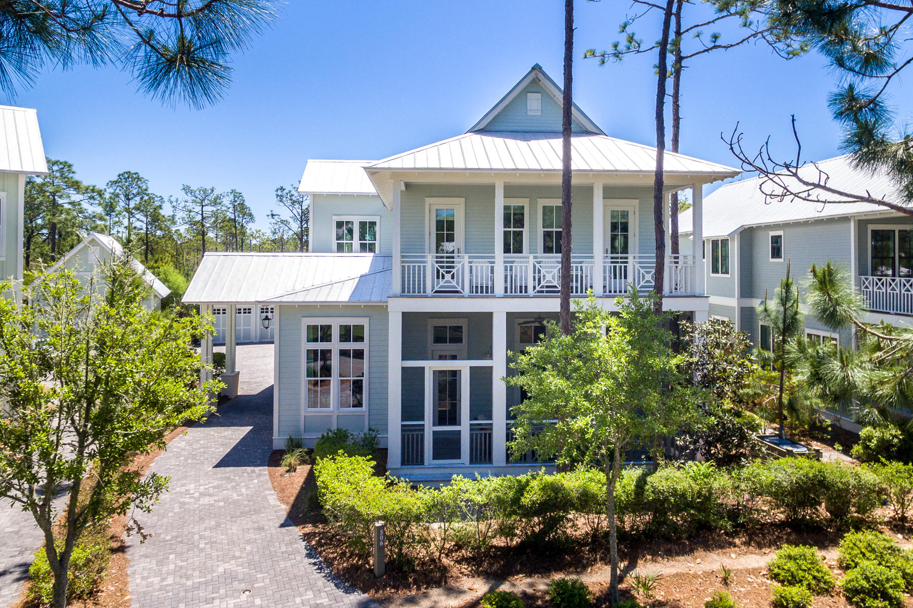 Stunning custom home in the quiet and secluded Cedar Woods section of Watercolor. Custom built by Romair Construction, this home has had only one owner and never been rented. No detail was overlooked in the design of the home, it's finishes & furnishings. The breathtaking open concept great room offers soaring 12' ceilings, abundant windows, a stunning state of the art kitchen & lovely dining area all overlooking the pool & spectacular outdoor living area. The kitchen has white quartz countertops, custom cabinetry, Wolf & Sub Zero appliances including an icemaker & wine fridge. Open the triple set of French doors in the great room and step outside by the pool, relax under the cabana by the outdoor fireplace, enjoy grilling in the beautiful summer kitchen or alfresco dining under....