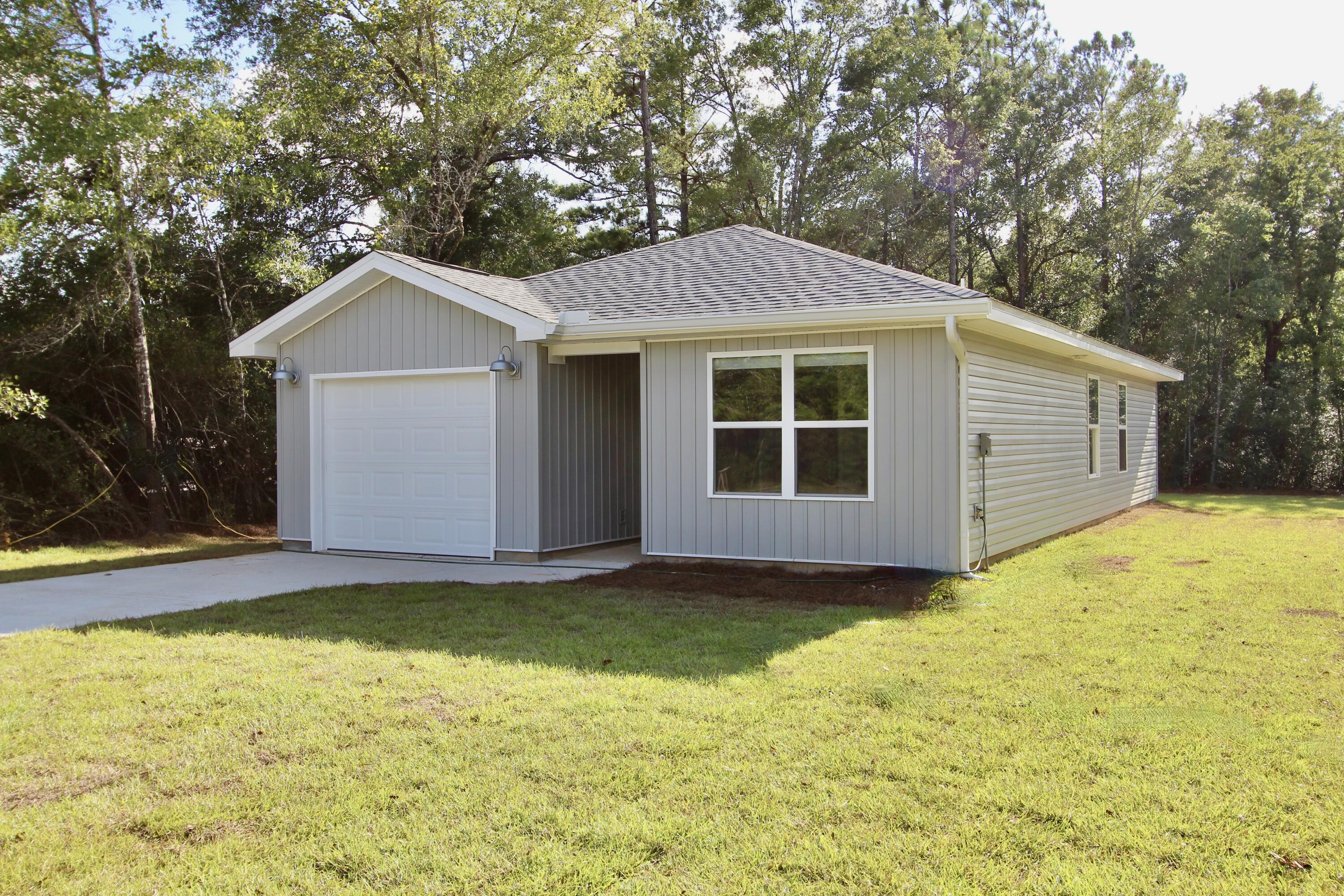Seller is offering on Conventional and FHA $5,000 towards buyers closing cost and on VA $0 move in special (restrictions apply).New Construction is completed and ready for a owner! Vinyl siding will be Wicker and roof is Weatherwood.This is a 2 bed 2 bath home. The home features LVP throughout the home. The kitchen is open to the living room and features an island, stainless steel appliances, white tile backsplash, granite counter tops and an under mount sink, bathrooms also have granite counter tops! Don't delay and you may be able to pick you colors. Pictures are of a previous 2 bed 2 bath home for illustration purposes and to show color style and quality of build.
