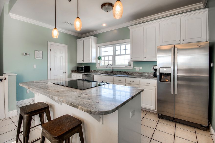 Incredible opportunity to own one of the closest possible homes to Pier Park in Panama City Beach, Florida. This three story beach home is situated directly across the street from beach access, offers covered parking, community pool and the best location in town. The third level features an upgraded kitchen, dining and living area along with a half bath and covered balcony with wonderful beach views. The second floor offers two bedrooms and two baths while the ground floor offers one bedroom and one bathroom. The convenience offered by this home is second to none and it has an exceptional rental history. The kitchen was recently remodeled with stainless appliances and granite countertops. This home is one of the best buys on the beach and will not last long. Get in now before Spring!