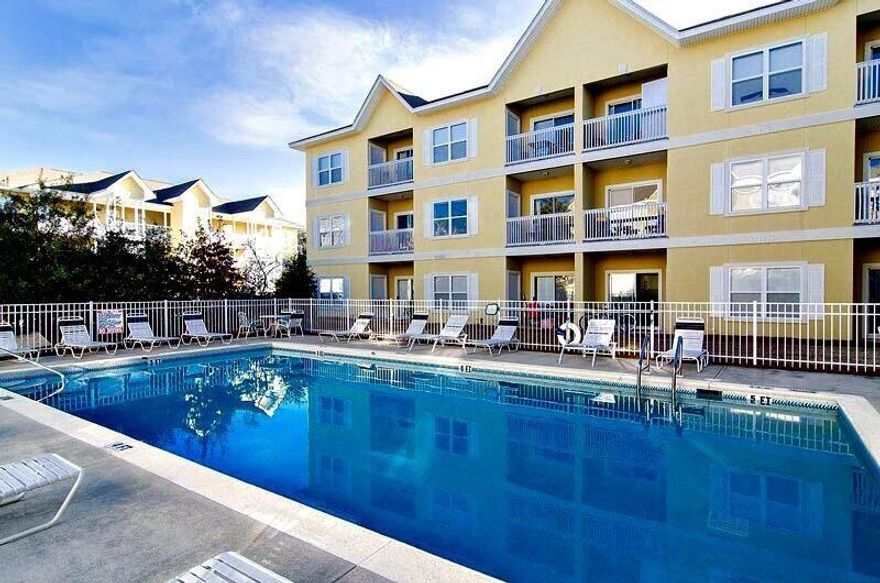 UNDER CONTRACT IN 2 DAYS!! 
TOP FLOOR CORNER UNIT has 2 BR/2 BA w/ covered porch overlooking trees off of Living area
COMMUNITY POOL & GATED ENTRY for privacy

SHORT STROLL to the BEACH!!

Just short walk to Eastern Lake w/ storage for kayaks & canoes- borders 18,000 acres on Pt. Washington State forest on north- 5 min to beach access. Better hurry! This one won't last long!