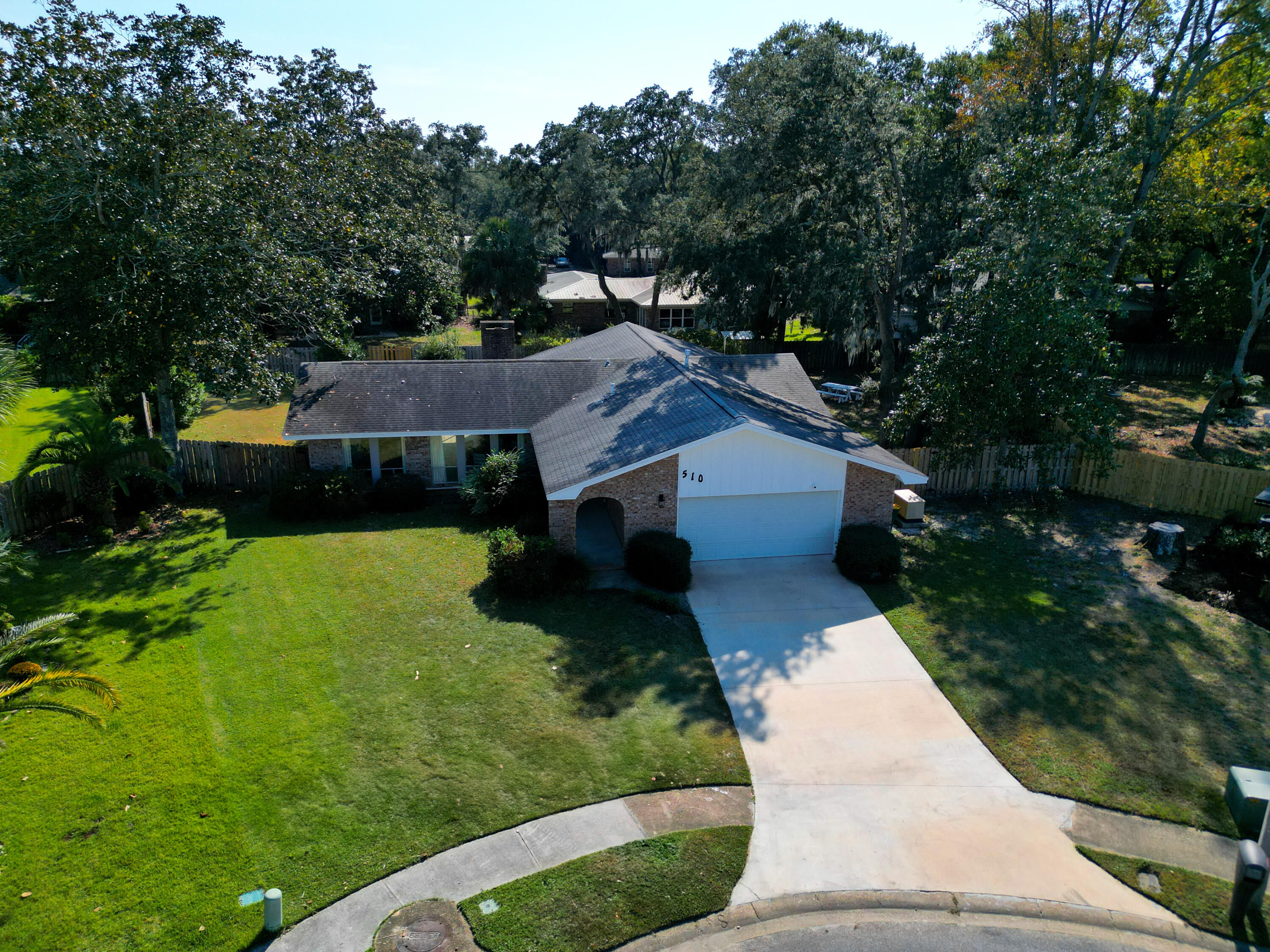 This stunning 4-bedroom, 2-bathroom remodeled home with a 2-car garage blends modern comforts with rustic charm, sitting on a spacious.33-acre lot in a quiet cul-de-sac. The open-concept layout seamlessly connects the living room and kitchen, creating an inviting space filled with natural light, perfect for gatherings. The fully remodeled bathrooms feature elegant travertine tiles, with the primary bathroom boasting a luxurious rainfall shower for a spa-like experience. Practical upgrades include updated HVAC system, water heater, modern flooring, light fixtures, modern appliances, and PEX plumbing. Safety and durability are prioritized with hurricane shutters on the front and rear windows, a generator, and a hurricane-rated sliding glass door. Combining style, functionality, and peace of mind, this home offers everything you need for modern living. HVAC 2023, HWH 2022 (10 year warranty), Roof 2015 (Recently inspected, 10+ years of useful life). *VA ASSUMABLE LOAN AT 4.6%*