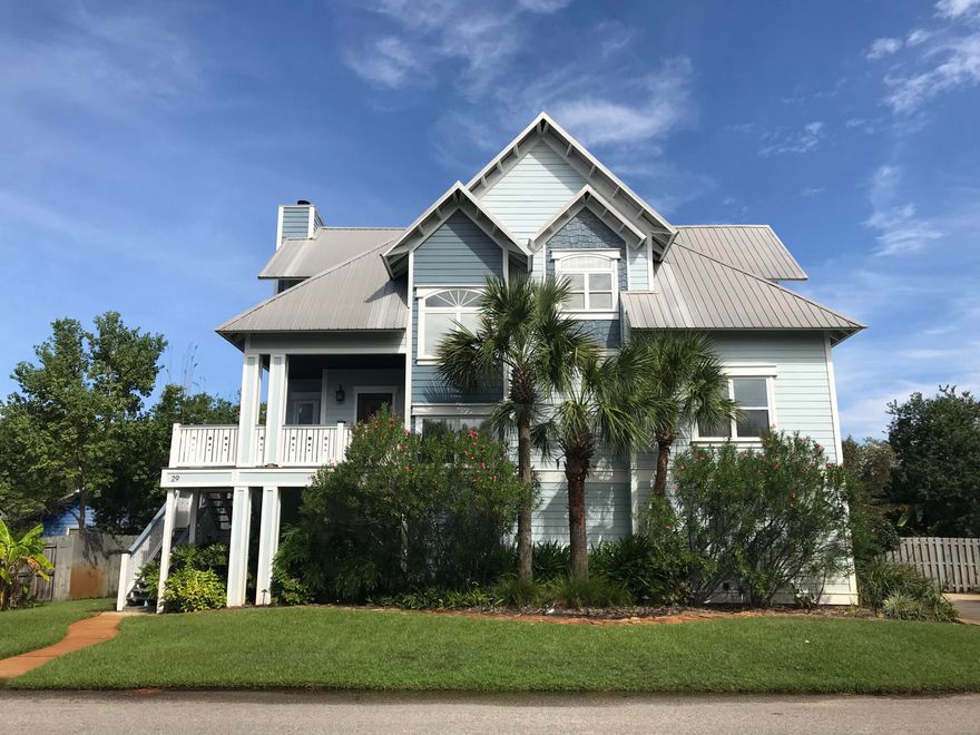 Wow! The impressive entry to this spectacular custom built home opens to a soaring two story living area featuring mahogany French doors with Emtek hardware, a ship-lap 24' ceiling, and floors accented with costly square cut nails. An expansive and open floor plan includes a light filled kitchen with a massive island, granite counter tops, stainless appliances, and access to two of the four decks for convenient outdoor entertaining. The first floor is a one bedroom apartment with it's own kitchen and full bathroom, allowing privacy and comfort for guests. Two patios lead out to the private entrance and professionally landscaped backyard. Located on the third floor is the luxuriously over sized master suite with a vaulted ceiling. A private deck off your master bedroom is perfect for