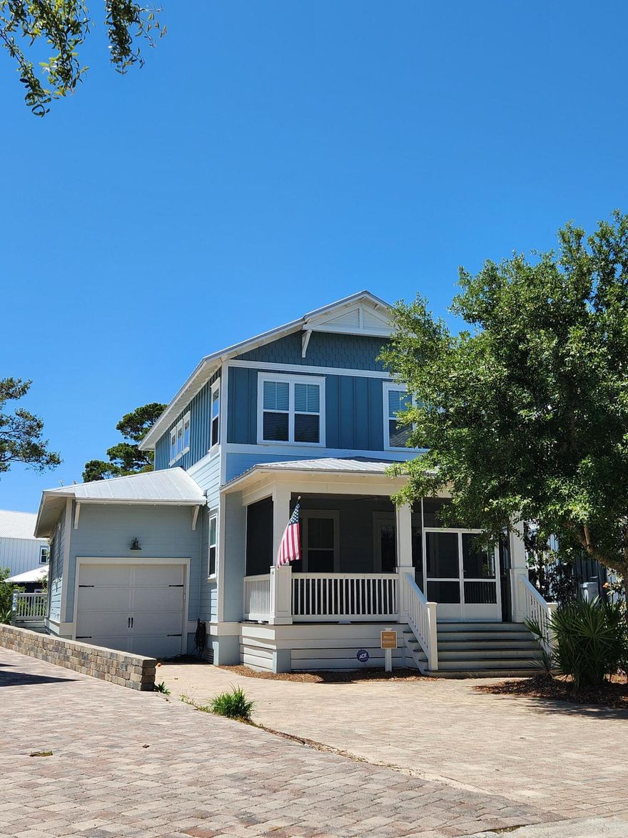 This freshly painted 4 Bed, 3 1/2 Bath beauty has new flooring and 2 new AC units! Enjoy the HUGE driveway, enough for 5 cars to park! Upgraded features: Crown molding, wainscoting, and a huge paver patio in the back! Enjoy starry nights in the hot tub, located on the screened-in deck. Kitchen has stainless appliances, gorgeous quartz counters, pantry and lots of cabinets.  Safety features:  hurricane-rated windows, concrete-filled cinder block foundation, 5-V Crimp metal roof, and closed cell insulation, sealing the home from underneath.  Unique plan with 1st floor primary bedroom suite, and second one upstairs! Community pool area features hot tub, gas fire pit, pavilion with kitchen/grills, outdoor shower, etc. Near Blue Mountain Beach!
