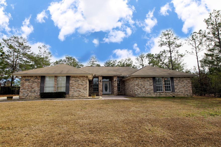 Looking to have it all? This is it! Space, land, move-in ready. This home is located nearly equidistant from 85 and 285 so there is no need to sit in traffic! The outdoor kitchen sits on a 1200 square foot paved patio complete with firepit, built-in gas grill with hidden propane storage, and plenty of counter space for prepping and serving!This home features many seller added features including built in shelving and desk in the front den, beautiful built-in storage in the master closet, shelves on the wall of the garage, and did I mention the patio and outdoor kitchen? Sitting on over an acre, this beautiful corner lot has mature trees and gorgeous curb appeal.Wanting more?