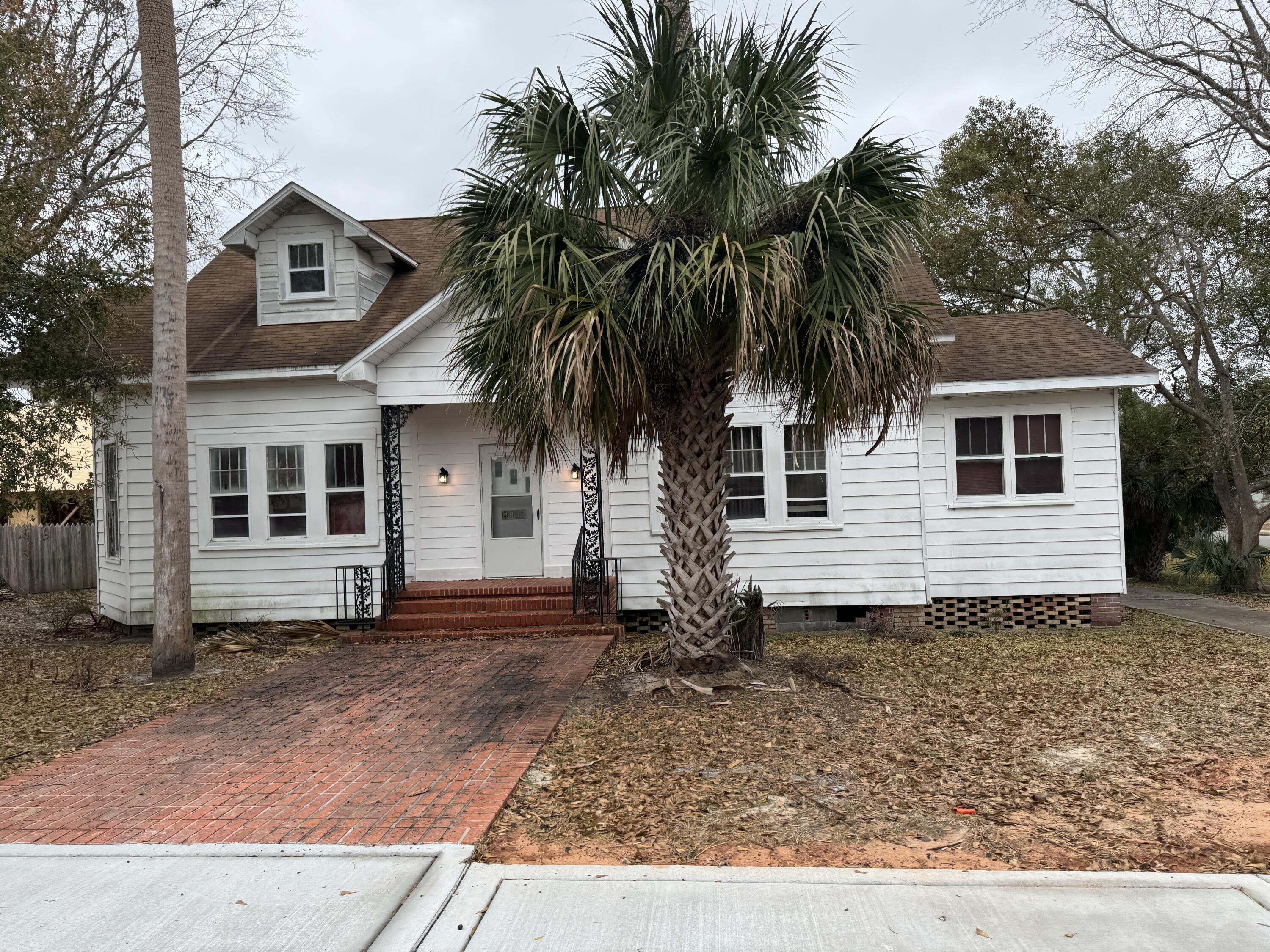 Just reduced! Wonderful! History galore in this old home located in the magical Historical District in Milton. 5108 Escambia has a plethora of charm and character, not seen in homes today. 5108 Escambia was built on a large corner lot that backs up to Santa Rosa St, just one block off the  Blackwater River.   A stone's throw to restaurants, festival grounds, and fun times!  The amazing characteristics are never-ending!   This lot is zoned residential/commercial.  If you have an entrepreneurial spirit you can live and build your business in this lovely area of Milton. This wonderful old home features a large welcoming living room with lots of natural lighting. A center foyer gives access to the additional rooms. It has the coolest and largest pull-down attic access with a solid wood