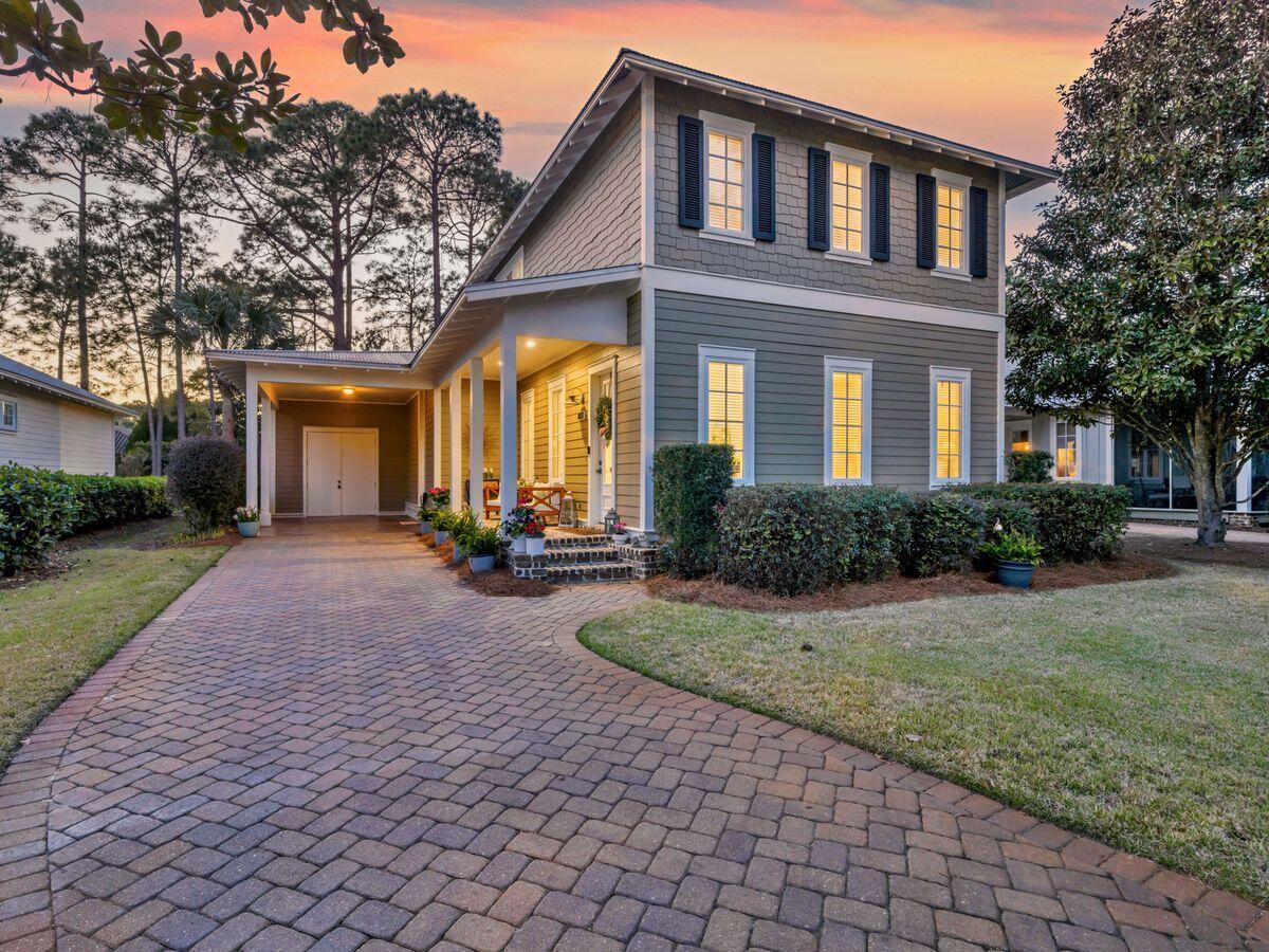 Located on one of the premier lots in Carson Oaks, this beautifully crafted three-bedroom, three-bathroom home offers a perfect combination of modern luxury and timeless charm. Built by Huff Development and surrounded by majestic live oak trees, this Florida cottage-style home is designed for those who appreciate exceptional craftsmanship and a vibrant community lifestyle. For boating enthusiasts, the private boatyard with deep-water access to Mack Bayou and Choctawhatchee Bay, along with gated boat storage, a dock, a boat launch and an outdoor entertaining pavilion, makes this community truly unique. As you step onto the inviting Charleston-style front porch at 310 Carson Oaks Lane, you're greeted by 10-ft. ceilings and an open living, dining and kitchen area perfect for entertaining. A spacious bedroom with a full private bath is conveniently located on the main floor, while two additional bedrooms, including the master, with ensuite bathrooms are situated on the second floor, plus a bonus room, offering privacy and comfort for family and guests. The home is thoughtfully updated with a fully renovated kitchen featuring new quartz countertops accented by gray subway tile backsplash, new white cabinetry, and stainless-steel Whirlpool appliances. New LVP flooring and recessed LED lighting throughout enhance the elegant, yet comfortable interior spaces. The master bathroom has been beautifully upgraded with a tiled shower and quartz vanity, creating a spa-like retreat. Positioned on an oversized lot backing up to the Sandestin Golf & Beach Resort property, this home boasts an expansive private backyard perfect for outdoor gatherings, pets or simply relaxing. The outdoor screened porch is accentuated by a brick patio with a flagstone walkway, bistro lighting, and lush tree canopies, offering a serene and picturesque setting. Carson Oaks is renowned for its exceptional community amenities, including a large swimming pool with new furniture and TVs, a new pickleball court, a fishing pond with green spaces framed by hundred-year-old oak trees, and a private boatyard for year-round enjoyment. Conveniently located near Highway 98, Sandestin and Grand Boulevard's premier shopping and dining, this home is ideal as a primary residence, second home or long-term rental investment.
