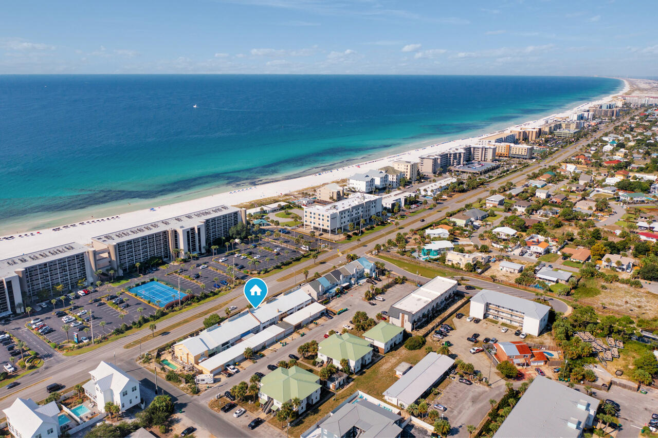 Welcome to island living! This remodeled 3BR/3BA townhouse is perfectly situated with public beach access directly across the street, making it easy to enjoy the sugar beaches & emerald waters of the Gulf. The first floor features an updated kitchen with modern finishes, an open living area and a half bath. On the second floor, you'll find a spacious master suite, a second bedroom, and full bathroom.The third floor includes a versatile loft with its own full bath, great for guests, office, or extra living area. New flooring & fresh paint throughout. Enjoy two covered patios and private garage.Perfect as a primary residence, a beach retreat, or investment property with easy access to restaurants, shopping, and entertainment, all while enjoying the relaxed charm of Okaloosa Island. No HOA's