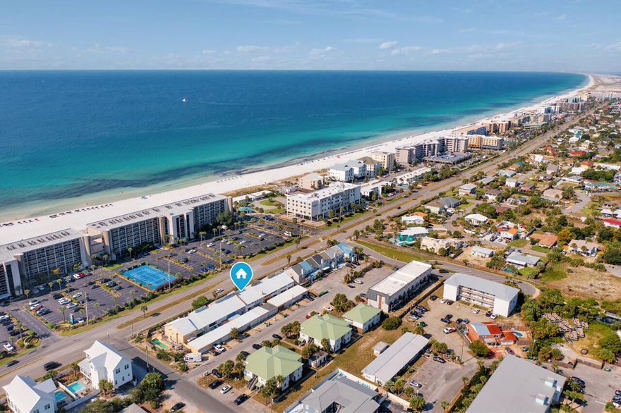 Welcome to island living! This remodeled 3BR/3BA townhouse is perfectly situated with public beach access directly across the street, making it easy to enjoy the sugar beaches & emerald waters of the Gulf. The first floor features an updated kitchen with modern finishes, an open living area and a half bath. On the second floor, you'll find a spacious master suite, a second bedroom, and full bathroom.The third floor includes a versatile loft with its own full bath, great for guests, office, or extra living area. New flooring & fresh paint throughout. Enjoy two covered patios and private garage.Perfect as a primary residence, a beach retreat, or investment property with easy access to restaurants, shopping, and entertainment, all while enjoying the relaxed charm of Okaloosa Island. No HOA's