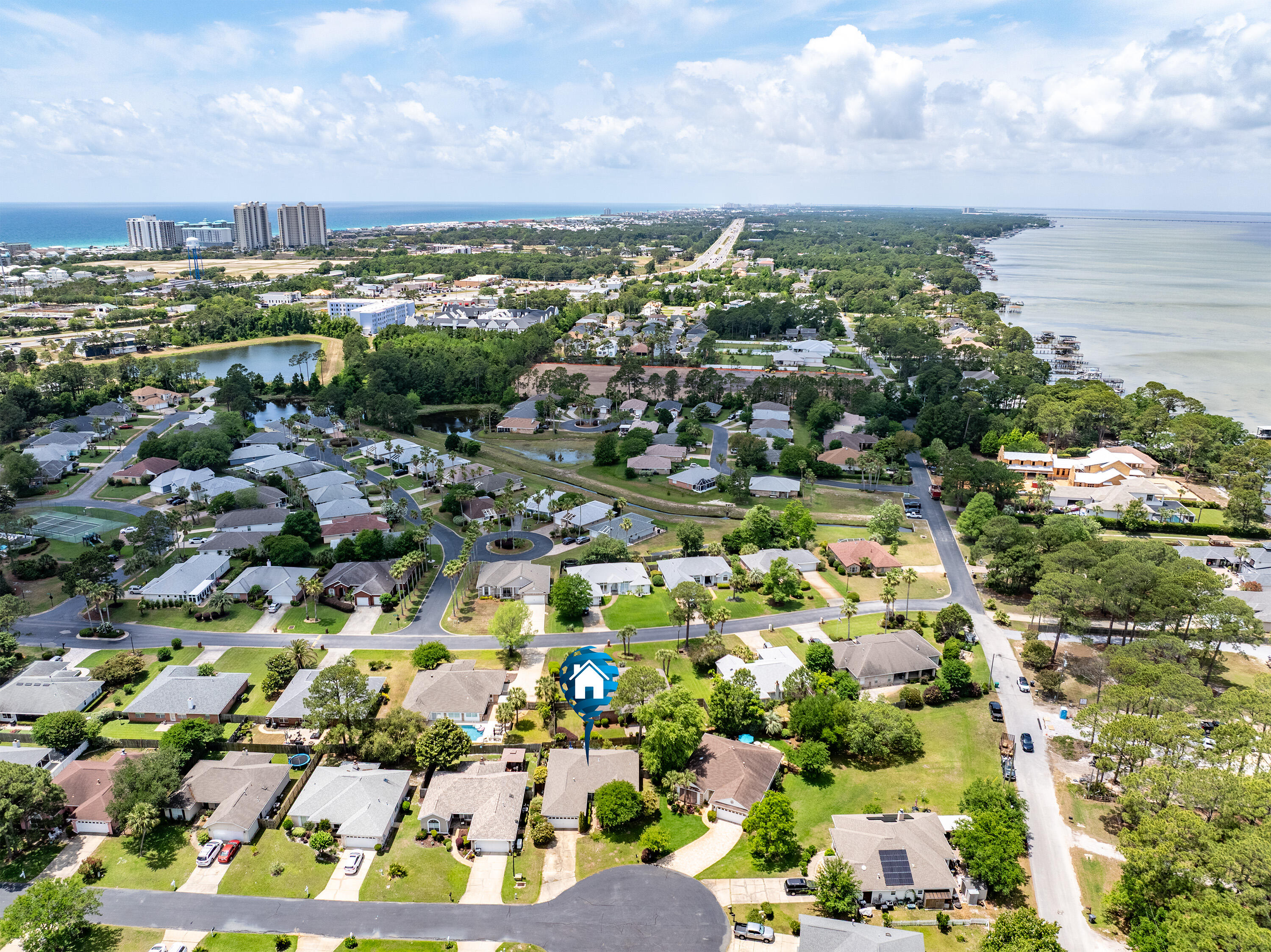 Location! Location! Location! This beautifully detached single family home in the heart of Miramar Beach is located less than a mile from the Emerald Coast and less than a 1/4 mile from Choctawhatchee Bay. Perfectly positioned between the bay and the coast, you choose your own adventure as both are just a few minutes drive. What more could you ask for? This 3Br/2Ba 1656 sq ft home is located in the idyllic neighborhood of Bayside. The kitchen has been recently remodeled with a contemporary look featuring a seafoam glass backsplash, a perfect canvas balanced by modern stainless steel appliances and complementing recessed lighting above. Entertain even the largest groups as you have tons of prep space with your large oversized kitchen island and ample counter space, all complete in white quartz.
Your spacious living room has a warm wood-burning fireplace for those cold winter nights and for those warmer days, you have multiple ceiling fans throughout the home. You'll find updated vinyl tile flooring throughout most of the home and your dining area has the most elegant pendant lighting with glows of amber and ivory tones. Vaulted ceilings add that level of sophistication that makes this house feel like a home, one filled with natural light and spacious surroundings.
Your primary bedroom is large enough for your king size bed and its complementing furniture and you have your own ensuite bathroom with tiled shower and dual vanities. Walk out to your garden through your french doors where you can have a little sitting area, all while enjoying the ocean and breezes and finishing that book you've been wanting to complete.
As a split-level floor plan, the other two bedrooms provide spacious room for your guest and/or family members, but also offering some privacy as these two rooms are near the front of the house. There is another bathroom that can be shared between the two front bedrooms.
You have plenty of space in your backyard to add your own garden flair as the sellers have quite a green thumb and will be taking their plants with them. Beautiful trees and bushes outline the exterior front and back of the home with a beautiful brick paved patio in the back.
Bayside offers a large and well-maintained community pool, beautiful brick walkways and sitting areas. Enjoy the shuffleboard and gazebo and there is a community dock, perfect for those who wish close access to water, one of the primary reasons for picking this beautiful home right in the heart of Miramar Beach! With close access to shopping, entertainment, and schools, this home truly has it all.