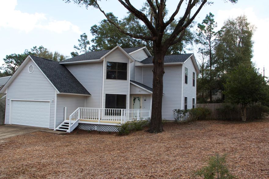 Come see this charming, spacious, newly renovated home situated on a huge corner lot with grand old oaks trees. Under the brand new roof, you will find a fresh coat of paint, new interior doors, new carpet, tile, new bath vanities and toilets. The eat in kitchen has brand new stainless steel appliances, new cabinets and counter tops. Off the kitchen there is a separate laundry room and storage under the stairs. Natural light shines in from the large picture window in the formal dining area. On the second level there is a spacious master with private new bath and walk in closet and 2 other bedrooms and another new bath. There is a great new deck out back in the large fenced back yard. Garage has lots of extra storage, brand new garage door and automatic opener with keyless entry pad.