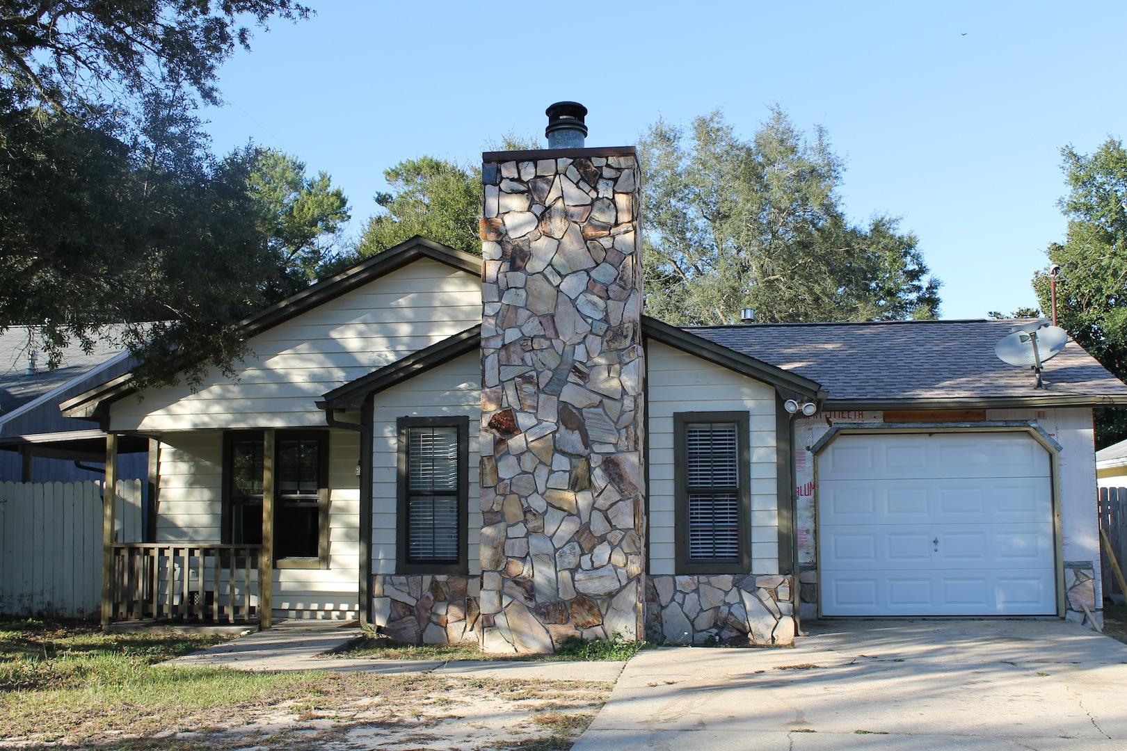 Great home in a perfect location. This home has been well maintained and has 3 bedrooms, 2 bathrooms and a large fenced back yard. The living room features a vaulted ceiling and a wood burning fireplace. Off the dining room is a covered porch. This house is centrally located and ready for immediate occupancy. Call today to schedule your appointment to view this home.