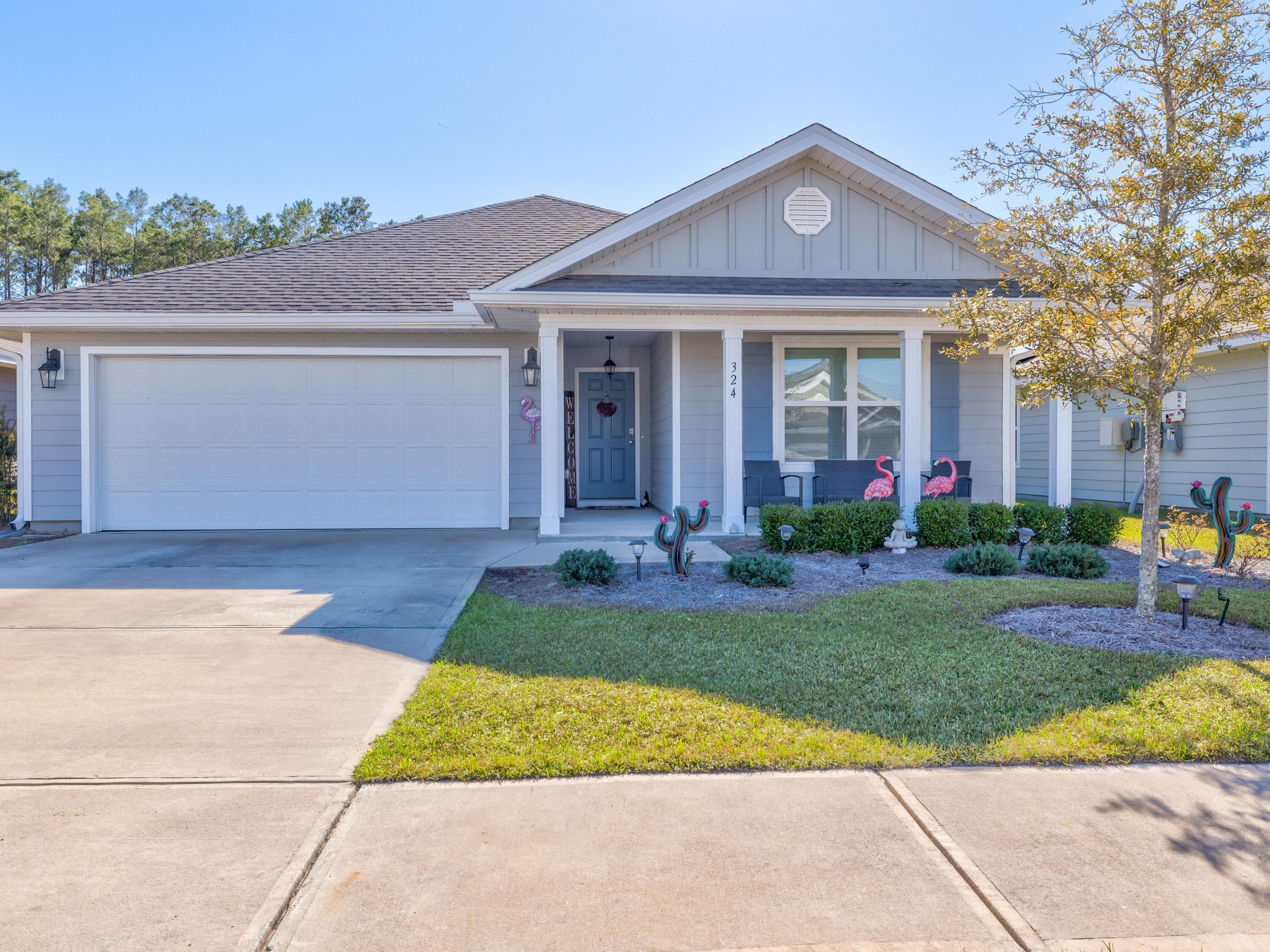 This ranch-style residence in Hammock Bay is in a prime location backing onto mature greenery in a nature preserve. The home has great curb appeal with ample parking, a two-car garage and a covered entrance porch. Completed in 2020, everything from the air conditioning to the stainless steel kitchen appliances is just two years old. Wood-look LVP flooring flows through the open-concept living area into the kitchen with its sleek white cabinetry. A capacious pantry tucks everything neatly out of sight. The center island accommodates a deep sink, dishwasher and breakfast bar. It's a natural hub where kids can perch on stools to do their homework or guests can hang out with margaritas and nibbles before dinner. Move across to the spacious dining area or put your feet up in the sitting area to relax and watch TV. The neutral d??cor provides a blank canvas in this light and spacious family room. Four bedrooms are equally well-sized with space for hobbies, guests or a growing family. A laundry room and built-in office round off the excellent facilities. Step outside into the screened lanai, which overlooks an enclosed yard laid mainly to grass. It's a generous space for kids and pets to romp and play. The mature trees beyond the boundary provide dappled shade for barbecues and alfresco dining. Local amenities deliver an enviable lifestyle in this master-planned community which boasts three communal pools, a lakeside clubhouse, movie room, gym, general store, playground and dog park. A 60-acre sports park and 10 miles of bike paths provide ample opportunity for outdoor recreation. The 500-ft. dock on Choctawhatchee Bay and beautiful white sandy beaches are just a short drive away.