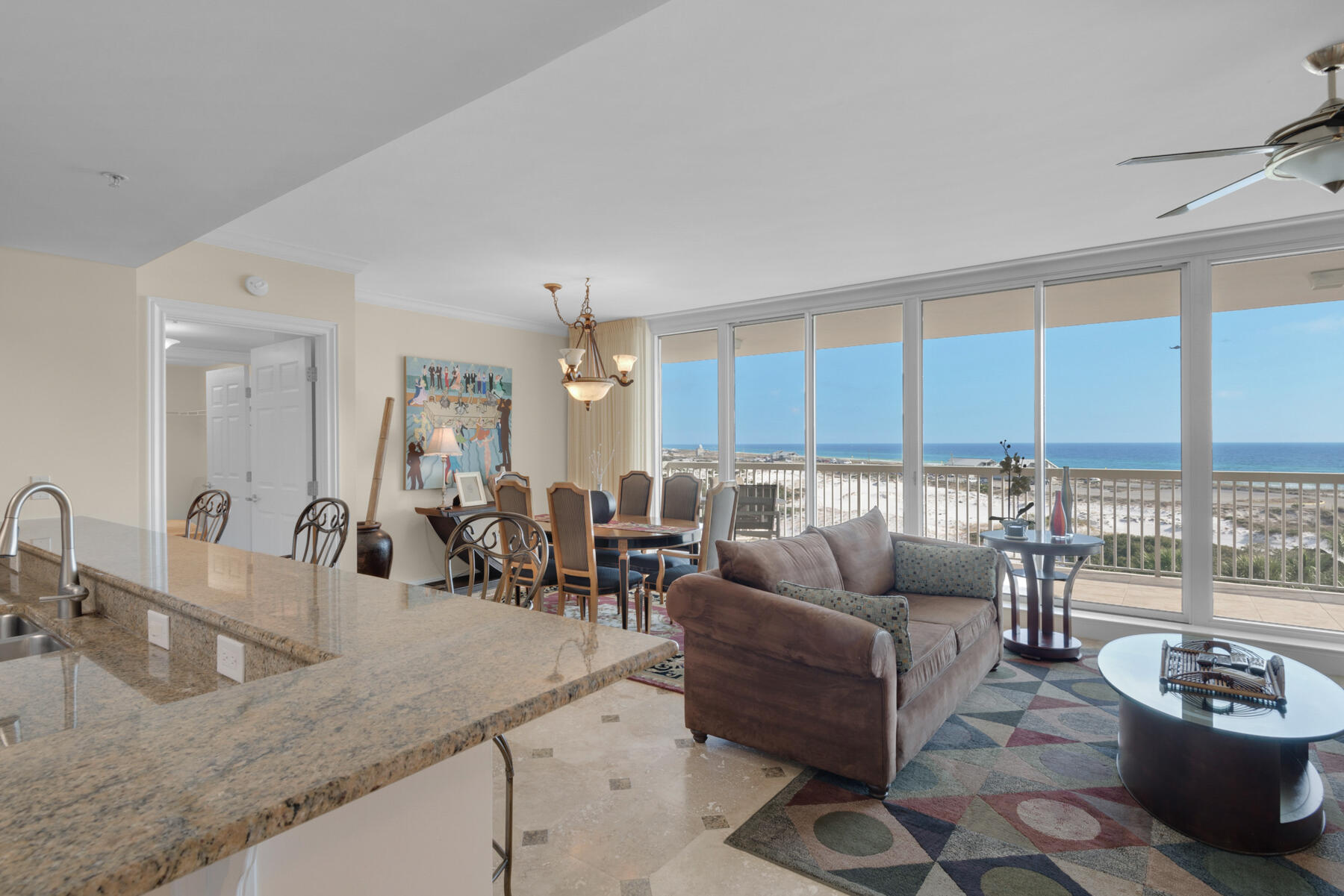 This large 2 bedroom, 2 1/2 bath condo in the short-term rental restricted building of St. Barth is a must see! The condo is on the east side of the resort which abuts Henderson Beach State Park providing endless views as far as the eye can see. Floor to ceiling windows abound in this unit. There is an expansive terrace that can be accessed from the living/dining area and both bedrooms. The kitchen boasts granite countertops, a huge breakfast bar, and loads of cabinet and countertop space. Wake up to a beautiful sunrise in the master bedroom suite providing a walk-in closet and en suite bath with double vanities, jacuzzi tub and separate walk-in shower. On the other side of the living area there is a guest bedroom also with en suite bathroom. In addition, there is a half bath and separate