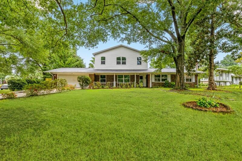 Seller is offering $5,000 toward buyer's closing costs for this spacious 4 bedroom, 3 bath home in the desirable neighborhood of Kenwood. The eat-in kitchen has room to seat a large group and is accented by a brick fireplace. From the kitchen you can look out your new windows to your relaxing pool. Downstairs you will find a living space, kitchen, 3 bedrooms and 2 full bathrooms. One of the first-floor bedrooms has an ensuite bath. Upstairs you will find a sizable second living area with a nook that could be an office space, bar, etc. On the second level there is also a bedroom with an ensuite and a walk-in closet. The laundry room has built-in storage and just around the corner is a great storage closet built under the stairs. The 2-car garage has built-in storage shelves as well.