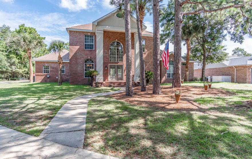 **REMODELED 4 bedroom 2 1/2 bath brick home with 3 car garage located on a cul-de-sac in a Bayfront community. Over 1/2 acre lot with in-ground pool with tropical waterfall, large brick paver pool deck and covered deck area. New ROOF & AC units in 2016. Saturnia stone entry, wood floors in living, dining rooms and faux wood tile in office: Saturnia tile kitchen, breakfast room and baths. Living room has a gas fireplace, and double sliding doors out to the pool deck. Spacious master bedroom & master bath with double vanity, separate shower & jacuzzi tub. Kitchen has tiled floors, nice cabinets, double oven, smooth cooktop, pantry, and a breakfast room just off the kitchen. Community dock in the neighborhood.