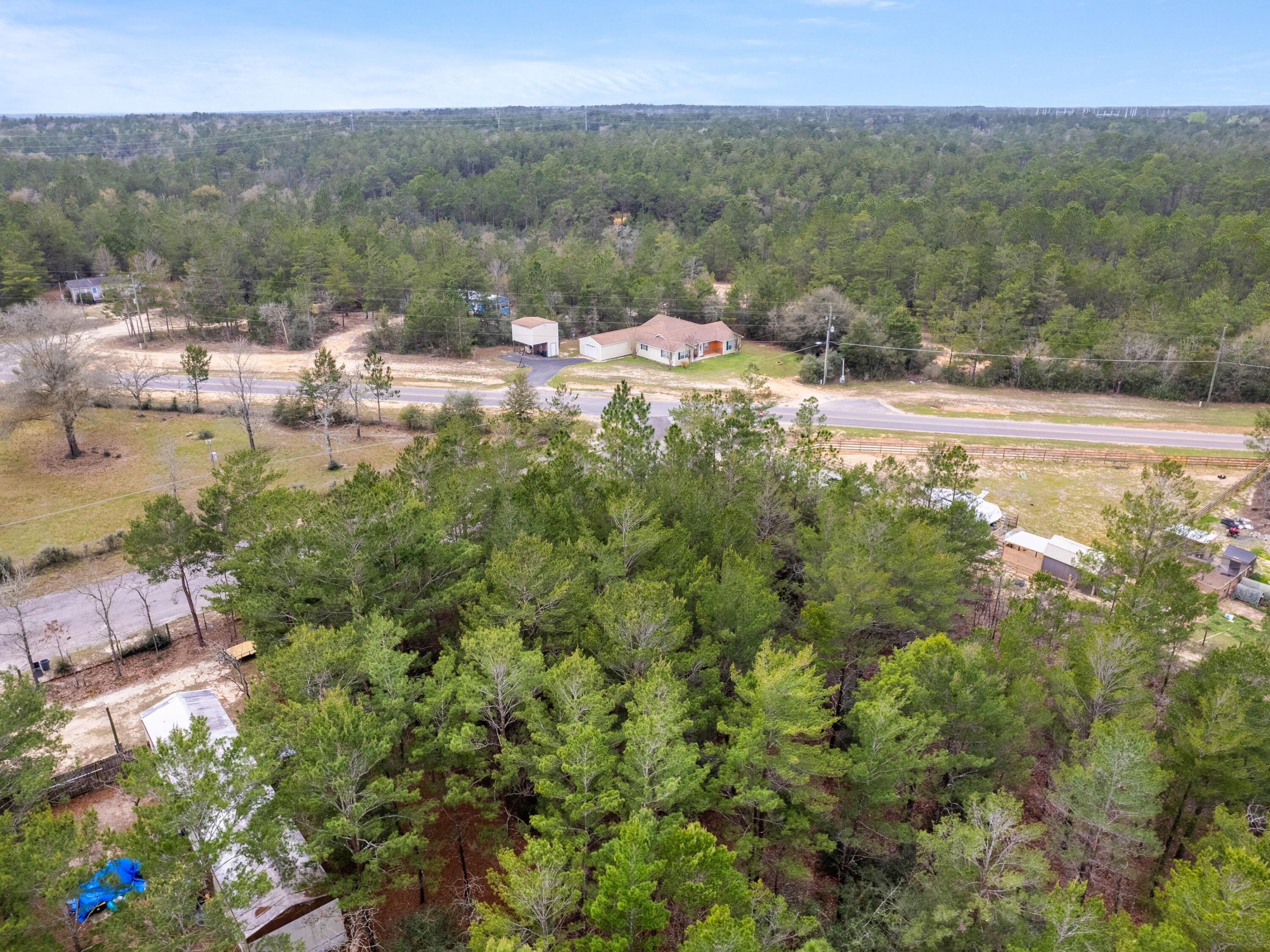 Nestled in the Oakwood Hills neighborhood, this vacant lot offers an unparalleled opportunity to craft your dream home. Smartly priced and ideally situated, you'll enjoy seamless access to U.S. Highway 90 and I-10, blending convenience with tranquility. Imagine building your sanctuary in this peaceful enclave, free from the constraints of build-out time and HOA fees. This charming parcel of land awaits the creation of lasting memories and the promise of a beautiful future. Embrace the possibilities today!