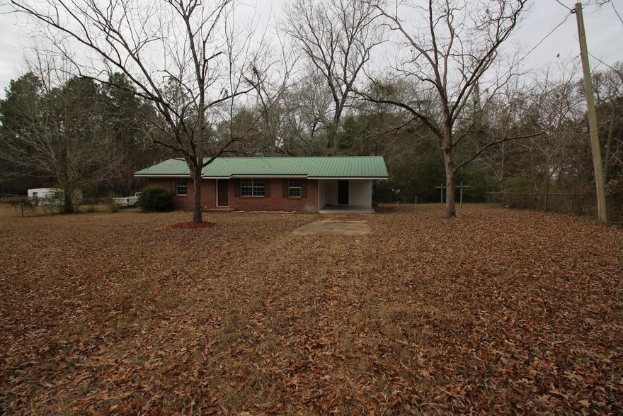 REMODELED 3 BED 1 BATH HOME  READY TO MOVE IN!!! With New 10yr Warranty AC System, Newer Metal Roof, Updated Electrical Wiring, New Paint Inside & Out, New Kitchen Cabinets, New Countertops, New Wood Floors, New Carpeting, New Tile Floors, New Lighting, Fans & Vanity, Large Wooded Private Lot, mostly fenced, makes relaxing easy and the list goes on  there is no honey do list. This home is comfortable and spacious and includes an open floor plan. Don't hesitate on this exceptional opportunity!