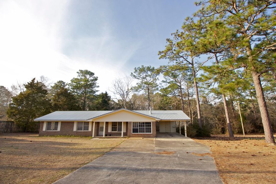 Entered for comp purposes only. Home needed interior cosmetic updating including paint, flooring, kitchen and bath updates, etc. New metal roof was installed prior to closing by seller.