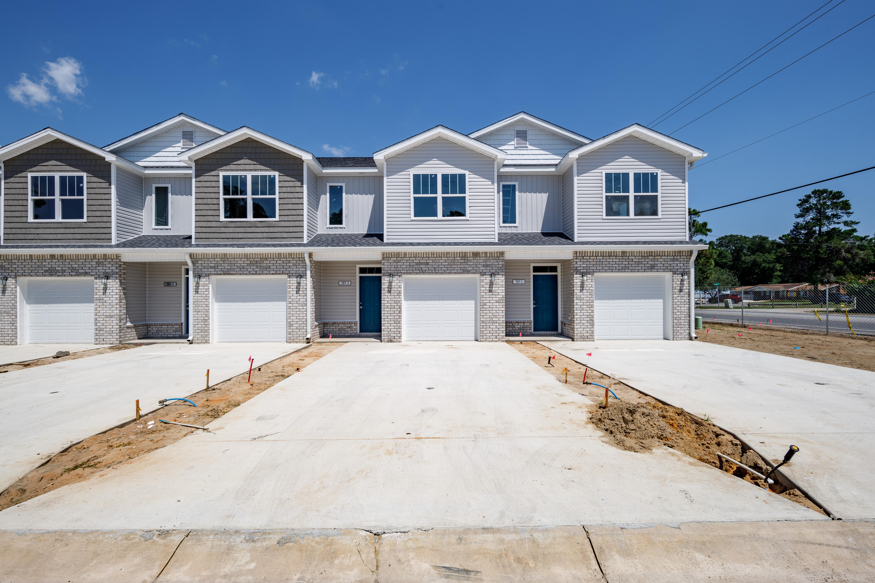 Brand NEW townhomes for sale in the heart of Fort Walton Beach! Orange Place offers 26 units in total, each with 3 bedrooms/ 2.5 bathrooms with an individual garage. This is unit 319-7, which is the fourth unit on your right. Downstairs you will find the living room, half bathroom, and a contemporary kitchen complete with Bianco Carrera Quartz countertops, soft close cabinets, and stainless steel appliances including a fingerprint resistant stainless steel side by side refrigerator. You will find LVP throughout the living and bathrooms, and plush carpet for comfort in the bedrooms. You are only a short drive away from the beaches, shopping, restaurants, Air Force Bases and more. There is an insurance quote attached for only $130.22/month. Make an appointment to come see a unit today!