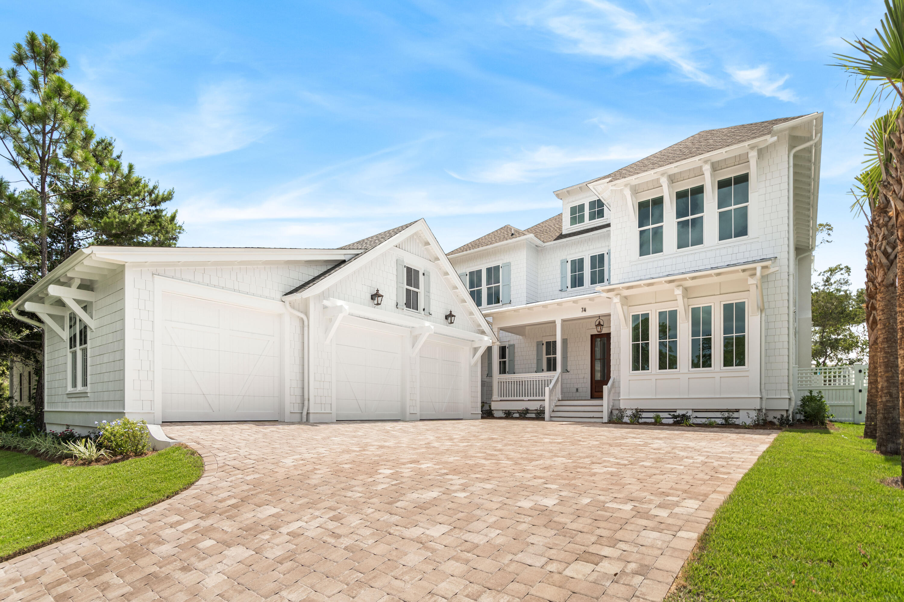 Classic coastal architecture welcomes you to this new construction masterpiece located on a quiet street near Camp Creek Lake and just a short stroll to the beach. With nearly 4,000 square feet, this property offers 4 bedrooms, a bonus room, and a spectacular outdoor area complete with private pool and spa. Built to the highest standards, find premium finishes throughout such as Venetian plaster walls, designer wallpaper, beamed and coffered ceilings, beautiful hardwood floors, custom millwork, intricate tile work, and designer lighting. The first level foyer leads to the spacious living and dining area with gas fireplace and a wall of windows overlooking the pool area. The chef's kitchen offers anything desired including Wolf and Subzero appliances, quartz countertops, a stunning