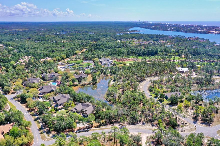 This large desirable B level lot measures .39 of an acre. Located on a wooded, secluded street that's just an easy stroll to the Sharks Tooth Club House at Wild Heron. It's nice elevation backs up to a peaceful pond. The Greg Norman designed private course meanders around Lake Powell and forests, with scenic elevation changes. Experience life in this gated 700 acre lifestyle community, just minutes from Rosemary Beach and scenic 30-A.