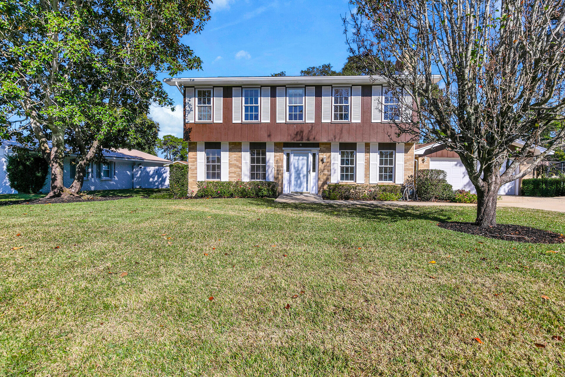 RENOVATED home in the Lake Lorraine area of Shalimar is ready and waiting for its lucky new owners! This traditional style home on a roomy .26 acre fenced lot has been recently updated to include new wiring, solid hardwood bamboo and tile flooring, light fixtures, fans, paint and updated baths! Downstairs you will find a large family room as well as a combined living and dining room area offering plenty of living space with access to the back yard patio through double French doors. The kitchen is adjacent to both the dining room and family room and it has a convenient door leading to the great back yard as well. The master suite, 3 additional bedrooms and another full bath are upstairs. The back yard features a yard building for extra storage and there is an attached two car garage as  well. Additional noteworthy features include 2020 roof, 2015 HVAC systems, almost all new windows, a new electric fireplace, a sprinkler system with a lawn pump and a recently serviced whole house GENERAC generator .  This home is truly MOVE IN READY and can be yours to love!