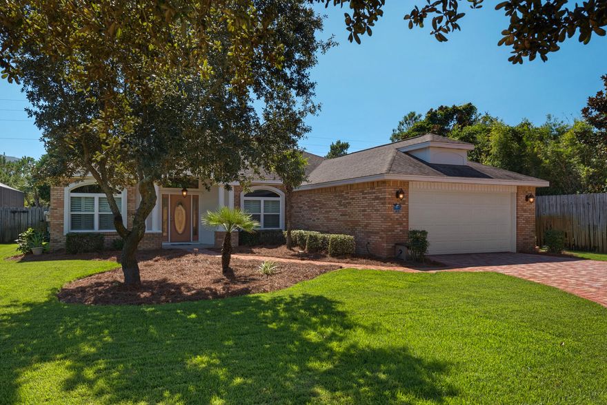 This immaculate Robert Fisher Signature home is located on a cul-de-sac in the highly desirable Destin neighborhood of Indian Lake. Lush landscaping frames this low maintenance brick home with privacy fence and large back yard. Upon entering, one feels right at home in the comfortable living room with fireplace and built-in cabinetry, beautiful formal dining room and well appointed kitchen. All kitchen appliances are less than five years old while the all gas stove/oven is brand new. The kitchen also features maple cabinets, breakfast area, computer desk, wine rack, eat-in counter, and access to the Florida room. Kitchen and bathroom counter top surfaces are rich granite. The newly remodeled bathrooms are meticulously designed for beauty, comfort, and functionality, to include, a large