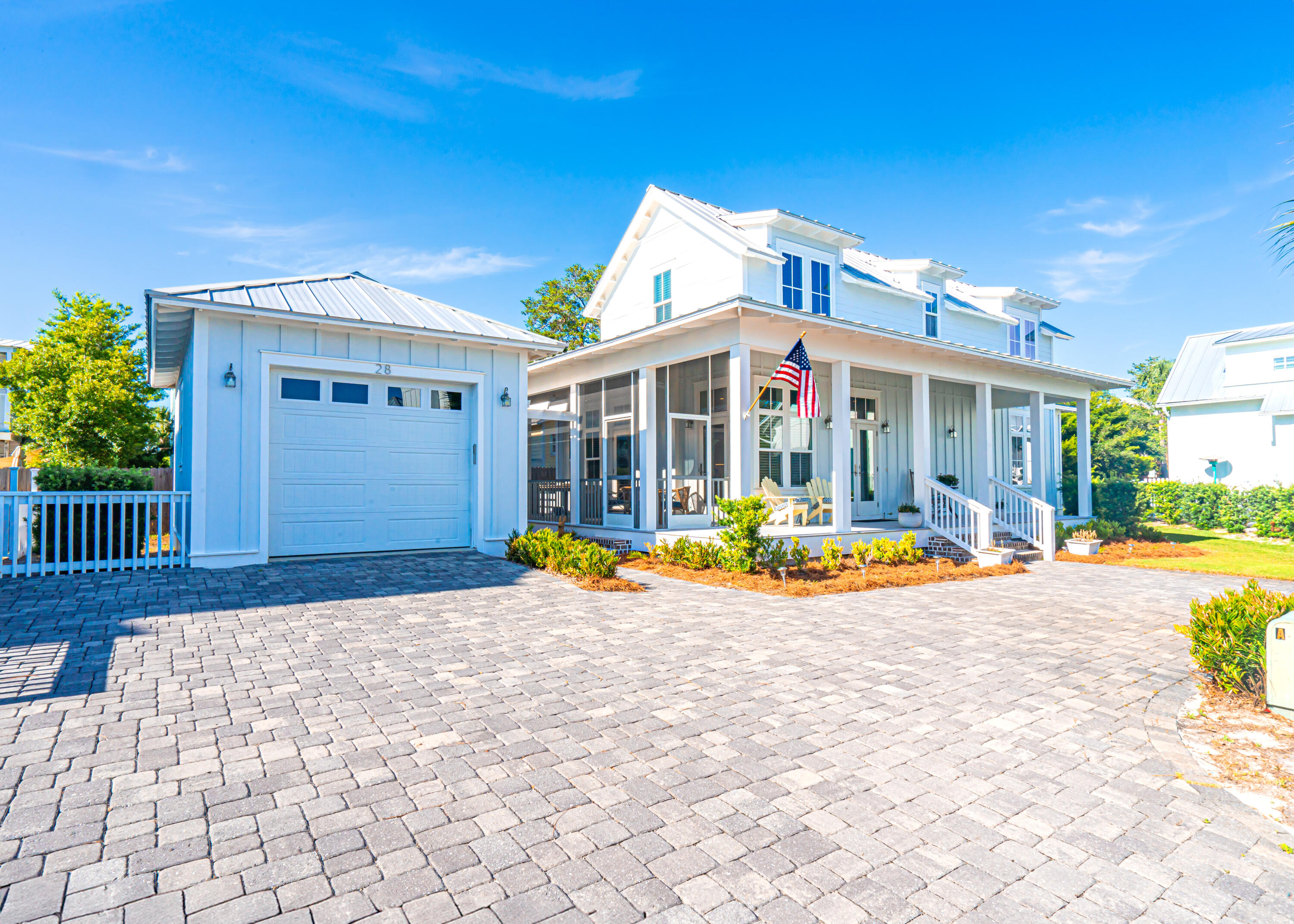 *Seller offering $25k towards new furniture or closing costs with an accepted offer.* Welcome to your better than new beach home.  When you step inside from the large front porch you'll be greeted with a thoughtful design that seamlessly integrates the living, kitchen, and dining area creating the perfect space to relax or entertain.  10 ft. ceilings and an abundance of windows and transom windows give the home an open and airy feel.  Expand the living area by opening the two doors on either side of the fireplace that lead to the screened porch.  The kitchen boasts upgraded appliances including a gas cook top in the center island, quartz countertops, and plenty of cabinets along with a pantry for storage.  The home is also equipped with a