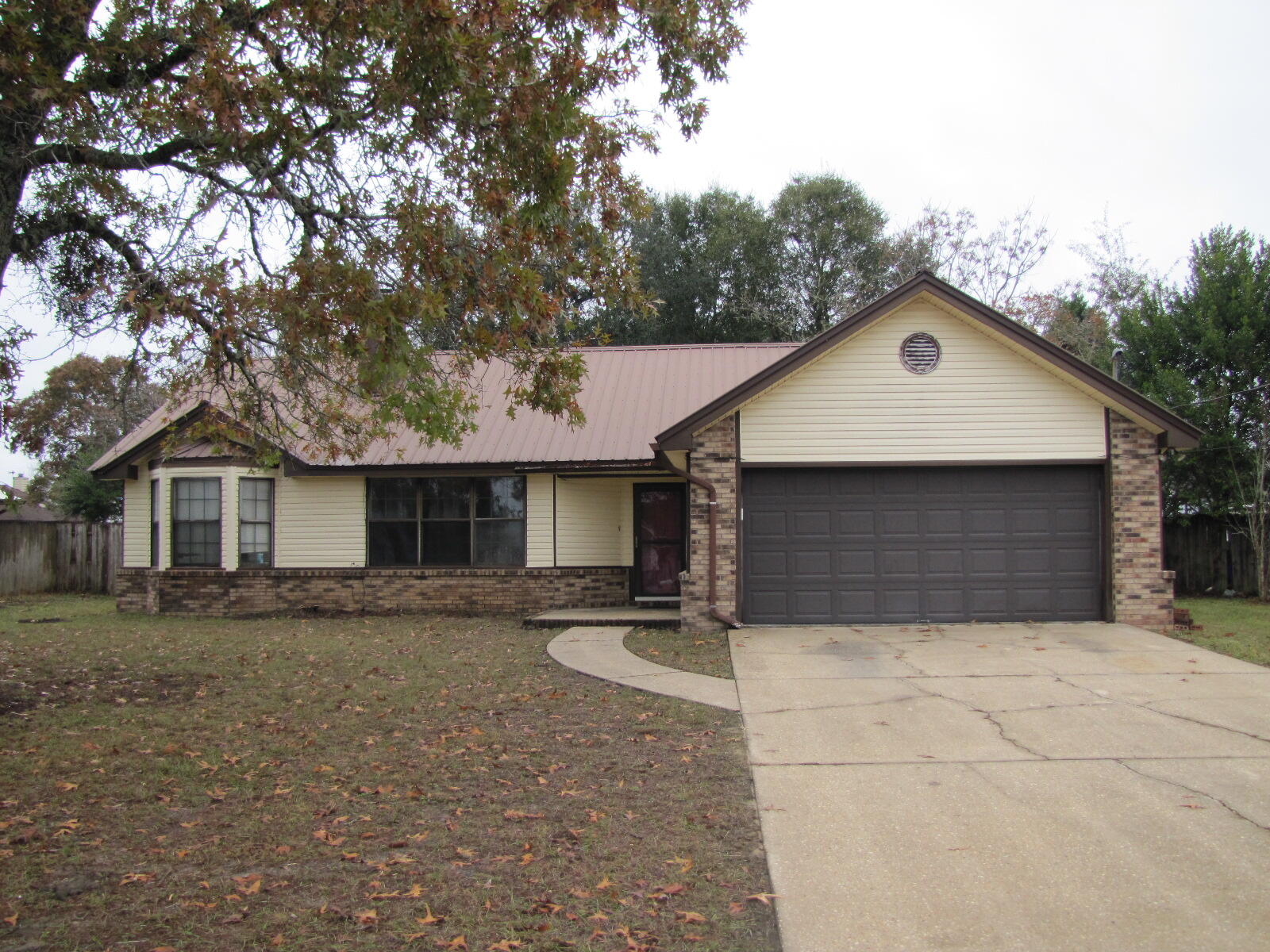 Located south of I-10 this convenient 3 bd/ 2 bth home is an easy commute to bases and shopping. The living room has a vaulted ceiling and fireplace. The eat-in kitchen has a dishwasher,stove, and refrigerator, Split bedroom design. Large privacy fenced backyard, 2 car garage.