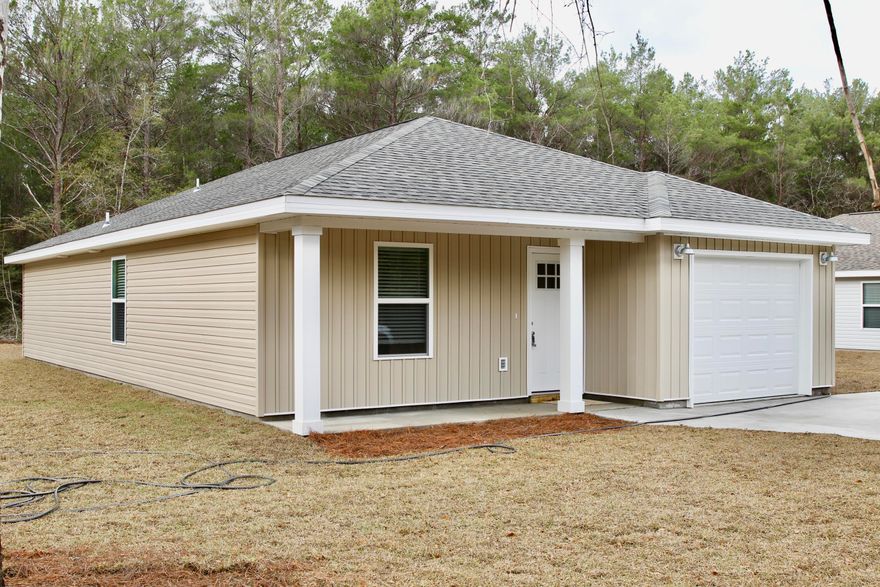 COMPLETED NEW CONSTRUCTION WITH A FENCE!New Construction 3 bed 2 bath on a Paved Rd. The home features LVP throughout the home. The kitchen is open to the living room and features an island, stainless steel appliances, white tile backsplash, granite counter tops and an under mount sink. The spacious master bedroom can hold a king size bed! The master bath has a walk in closet and the bathrooms also have granite counter tops!  Don't delay and you may be able to pick you colors. Pictures are of a previous completed home.