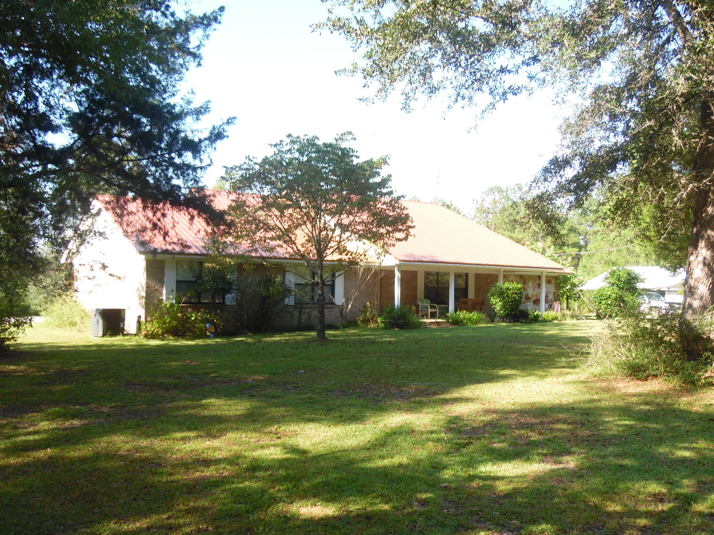 Private and secluded this beautiful all brick home tucked away on 30 acres. Complete with barn, workshop, 2 car carport, 3 Bedrooms, 2 bath, enclosed back porch, covered front porch, complete with office, extra large laundry room. Acreage has small seasonal pond, 24'x48' pole barn with double lien-to additions on each side for a total of 1152 SF. This is such a special property it has been listed at the current appraised value. ''So you are truly getting what you pay for in this one. Shown by appt. CLICK on MORE TAB to read other details from the SELLER.