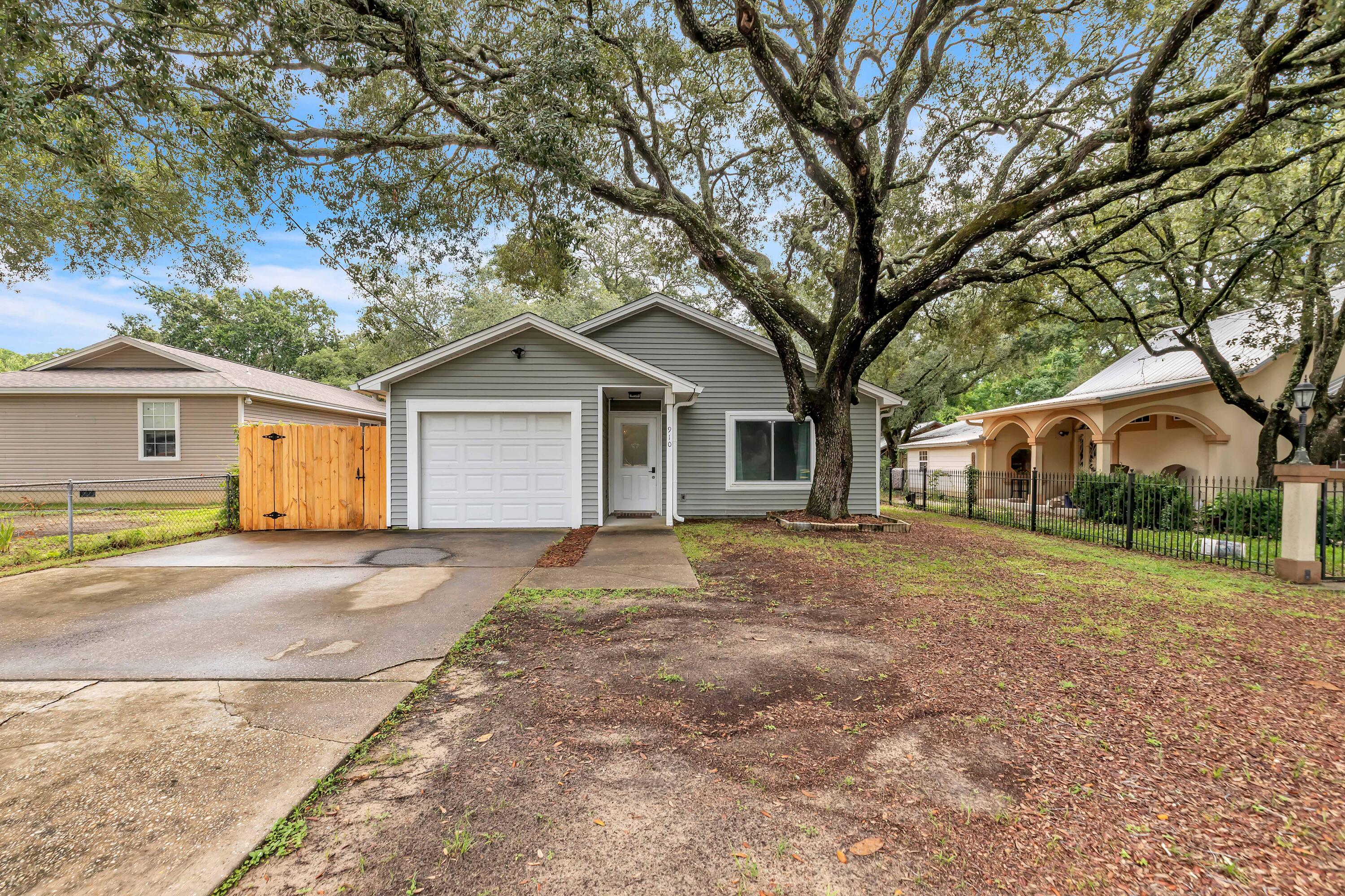 Beautifully updated home on a large lot in the heart of Niceville! This move-in-ready property features brand new flooring throughout, fresh interior paint, and a new privacy fence enclosing the spacious backyard. The updated kitchen offers white cabinetry, a newer stainless steel refrigerator, garbage disposal, and ample natural light--perfect for casual dining or entertaining. The renovated bathrooms include stylish vanities, modern fixtures, and a refreshed look that adds comfort and value. A sliding glass door from the dining area leads to an open patio and the generous fully fenced backyard--ideal for outdoor gatherings or pets.