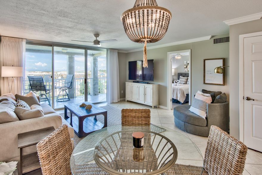 Views of the Destin East Pass, Gulf of Mexico and Crab Island from this 1st floor condo at Magnolia House located in the gated island community of Destin Pointe. The over-sized balcony affords spectacular views of the beach, water and some rather amazing sunsets. This condo has been updated with tile floors throughout & is offered fully furnished with its coastal decor. The master bedroom offers views of the water and its own ensuite. The guest bedroom features a king size bed, flat screen TV, & access to a private lanai.  The living space is an open concept with the kitchen, dining and living area all enjoying views of the water. This property is an ideal 2nd home or investment property. Destin Pointe is a gated island community featuring. two coastal dune lakes, two tennis courts, two community pools, and more than 3,000 feet of beach frontage.