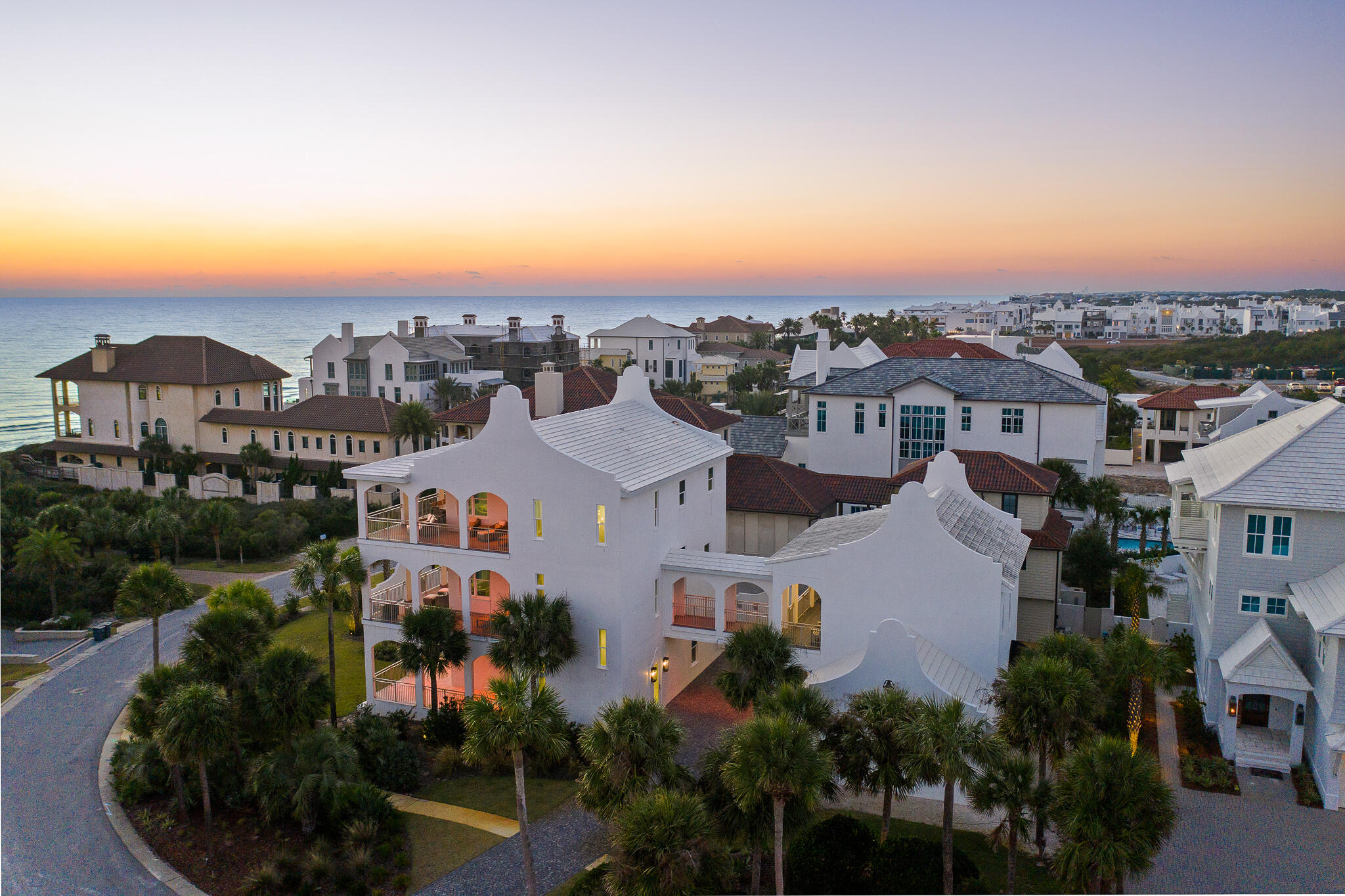 Stunning sunsets & gulf views await from this 2nd tier home in Paradise By The Sea.  A controlled access community, Paradise By The Sea is easily walkable to the many shops, restaurants, coffee shops, wine bars of Alys Beach and Rosemary Beach.  To make the most of the views, the grand kitchen and expansive living area are located on the top floor, easily accessible via the elevator or the stairs.  Outdoor living is in the forefront too with large, covered balconies on each level including a pool, fireplace and summer kitchen on the first level.  Plenty of parking, a one car garage plus a two car garage that has been converted into a heated and cooled play area for the youngsters and the young at heart.  The carriage house is connected via a 2nd level walkway to the main house and also has