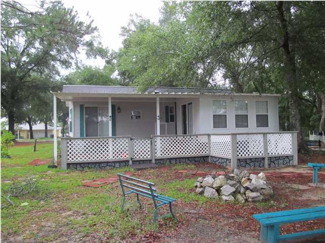 Seller financing! Waterfront property on King Lake! The 600 S.F. ''Park Model'' Chariot Eagle is licensed as a Recreational Vehicle. Partially furnished. Ready for vacation & family fun. Dock in place. Property also has 30 amp & 50 amp external power with septic tank hookup for RV. What a deal. Owner will finance with 20% down at 7% interest amortized for 10 years with a balloon payment of the balance due at the end of 3 years.