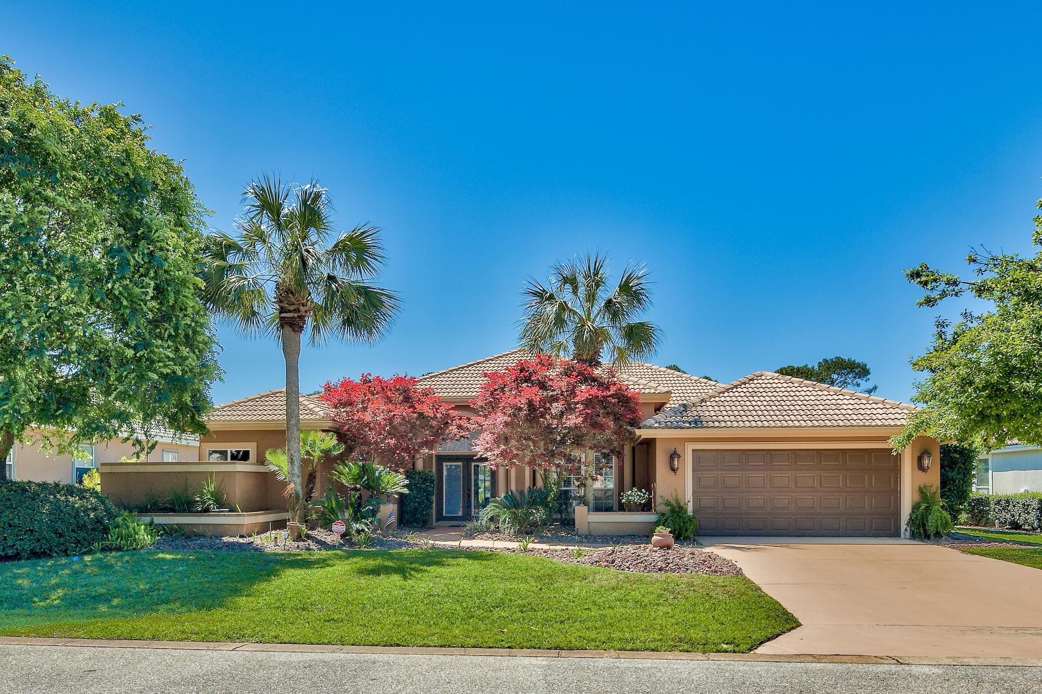 Exquisite lake view home on the 5th fairway of Emerald Bay Golf Course, which is an exclusive gated community. The pride of ownership shows. Features include saltwater pool and water feature enclosed with a large golf ball resistant screened lanai. Patio has a natural gas line hookup for grill and is surrounded by attractive landscaping. The exterior of this beautiful home is protected by Elastomeric paint and the driveway is newly painted. The interior features are numerous. The kitchen has been fully updated to include granite counters, upgraded cabinetry, stainless steel appliances, ice-maker, and mini-bar. Other interior features include crown molding, wood and tile flooring, built-in surround speakers, gas fireplace, updated master bath with custom floor to ceiling tile as well as