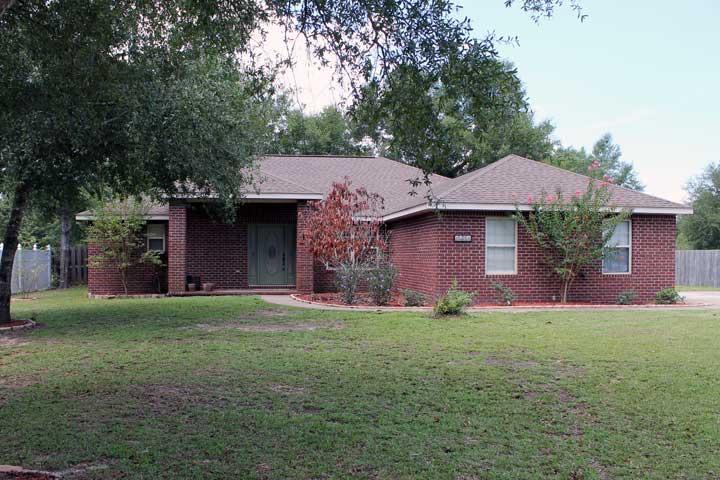Better than new! This kitchen has been updated with NEW granite counter with glass tile backsplash, NEW stainless steel appliances with updated lighting and faucet . Split bedroom plan. The master bedroom has trayed ceiling and full bath with separate shower and soaker tub. Outside you will find a fabulous deck with fire pit to enjoy the outdoors. Fabulous NEW Gunite pool. Shed for the handyman. Side entry garage. NEW high efficiency Air Conditioner. Underground invisible fencing for your pets. Enjoy the privacy of living in the country and yet only minutes to town and Duke Field. Come see this fabulous home today!