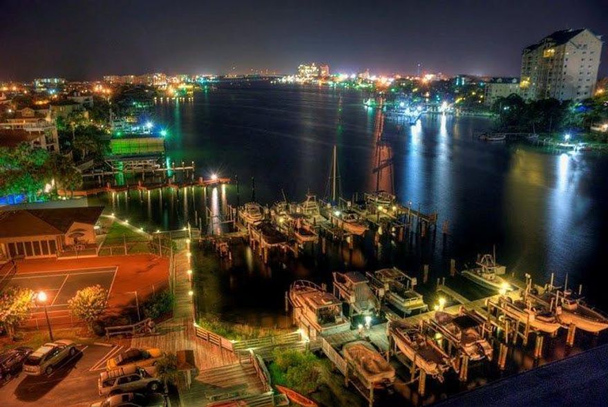 Just reduced making this the BEST VALUE at Dolphin Point. Come take a look at this beautiful condo today. Recently updated kitchen with quartz countertops and stainless appliances. Bathrooms both recently updated. Master bath has a beautiful tile shower. Travertine tile throughout living and dining areas.