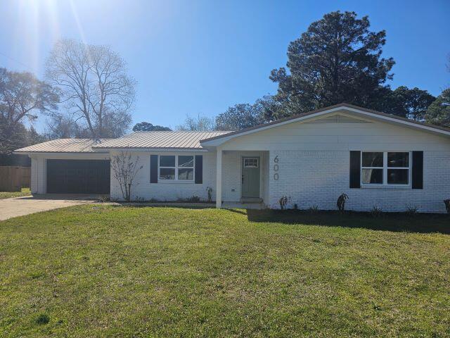 AVAILABLE NOW!- Fully remodeled 4 bedroom 2 bath home nestled on a corner lot, in the heart of Ft Walton Beach. This all brick beauty features a large family room and separate dining room with wood look LVP flooring throughout, new lighting, and gorgeous fandeliers with remotes in each room. The kitchen sports quartz countertops, stainless appliances and a flat surface cooktop, overlooking a large dining area. Updated baths feature gorgeous tile and stylish fixtures. Step out back to enjoy the large, fenced backyard with workshop while enjoying the warm summer breeze under the covered patio. This home is a rare gem and will not last long! Call today to schedule your tour! Applicants to verify items of importance such as school zones and room measurements. Credit and background check required