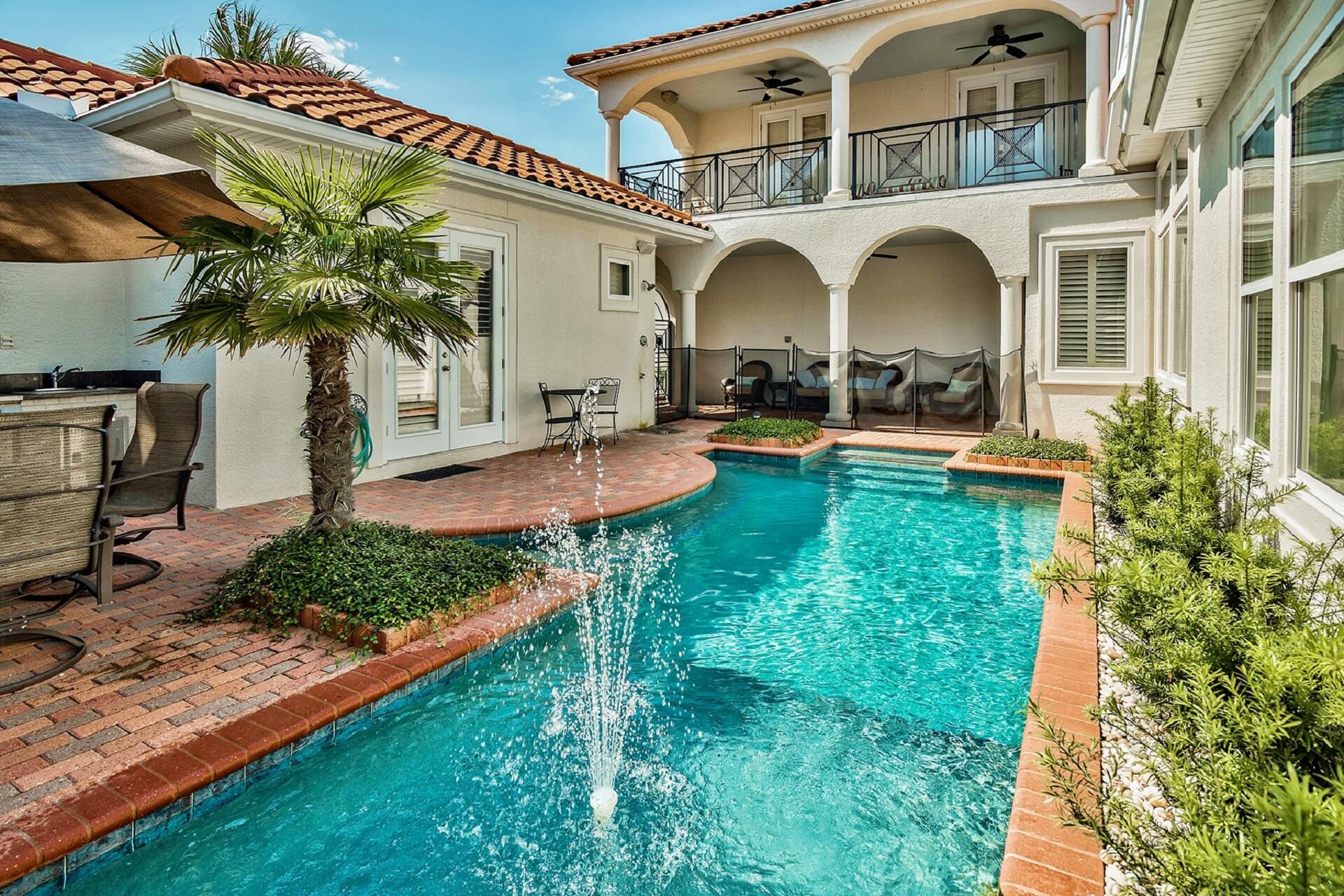 This exemplary coastal contemporary home ideally located in the gated golf cart friendly community of Destiny East would make the perfect year-round residence or VACATION RENTAL INVESTMENT. The home has PROVEN RENTAL History and is situated close to the beach. This thoughtfully designed courtyard home includes notable features such as a separate mother-in-law suite with private pool access and en-suite bath. The home is equipped with a full automation package that allows you control from your smartphone or tablet. The spacious open floor plan boasts marble flooring throughout the first floor with warm hardwood on the second level as well as soaring ceilings and comfortable living spaces.