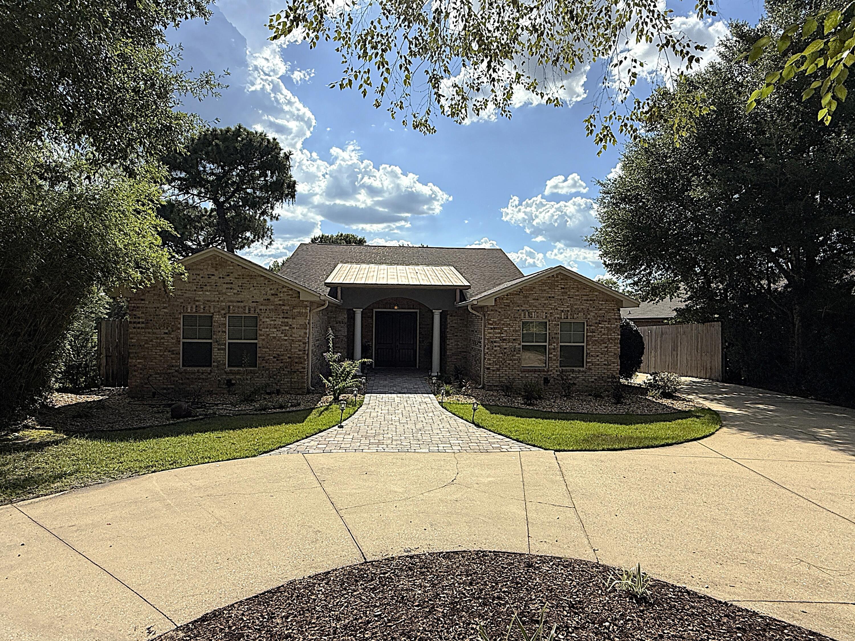 This one-of-a-kind property seamlessly blends thoughtful updates, major upgrades, and serious backyard appeal -- all in a prime location just half a mile from the Poquito Bayou boat ramp. With road access behind the yard, RV parking and an electrical hookup on the side, and a separate apartment offering income or multi-generational potential, this home truly stands out. A brand-new roof will be installed prior to closing, and the HVAC system and tankless water heater have both been updated. Inside, enjoy two spacious living areas, high ceilings, a fireplace, updated lighting, hardwood and stained concrete floors, and custom built-ins throughout. The kitchen is a chef's dream, featuring granite counters, double ovens, a wine fridge, beverage fridge, dining area, breakfast nook, and a custom pantry. The primary suite includes electronic blackout shades, a fully custom walk-in closet, and a spa-like bath. An $80K separate apartment offers incredible flexibility, complete with its own entrance, climate control, kitchenette, and full bath. Perfect for guests, in-laws, or rental income potential. Out back, it only gets better: the property sits on over half an acre and features a huge patio, outdoor shower, lush landscaping, and a screened-in pool and hot tub with a full outdoor kitchen. The entire space is designed for entertaining and relaxing year-round. A whole-house generator (routinely serviced) provides added peace of mind. Whether you're heading to the bayou for a day on the water or staying home to enjoy your private oasis, this property checks every box.