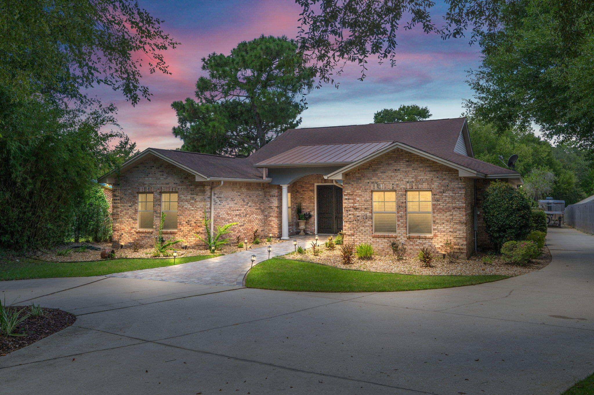 This one-of-a-kind property seamlessly blends thoughtful updates, major upgrades, and serious backyard appeal -- all in a prime location just half a mile from the Poquito Bayou boat ramp. With road access behind the yard, RV parking and an electrical hookup on the side, and a separate apartment offering income or multi-generational potential, this home truly stands out. A brand-new roof will be installed prior to closing, and the HVAC system and tankless water heater have both been updated. Inside, enjoy two spacious living areas, high ceilings, a fireplace, updated lighting, hardwood and stained concrete floors, and custom built-ins throughout. The kitchen is a chef's dream, featuring granite counters, double ovens, a wine fridge, beverage fridge, dining area, breakfast nook, and a custom pantry. The primary suite includes electronic blackout shades, a fully custom walk-in closet, and a spa-like bath. An $80K separate apartment offers incredible flexibility, complete with its own entrance, climate control, kitchenette, and full bath. Perfect for guests, in-laws, or rental income potential. Out back, it only gets better: the property sits on over half an acre and features a huge patio, outdoor shower, lush landscaping, and a screened-in pool and hot tub with a full outdoor kitchen. The entire space is designed for entertaining and relaxing year-round. A whole-house generator (routinely serviced) provides added peace of mind. Whether you're heading to the bayou for a day on the water or staying home to enjoy your private oasis, this property checks every box.
