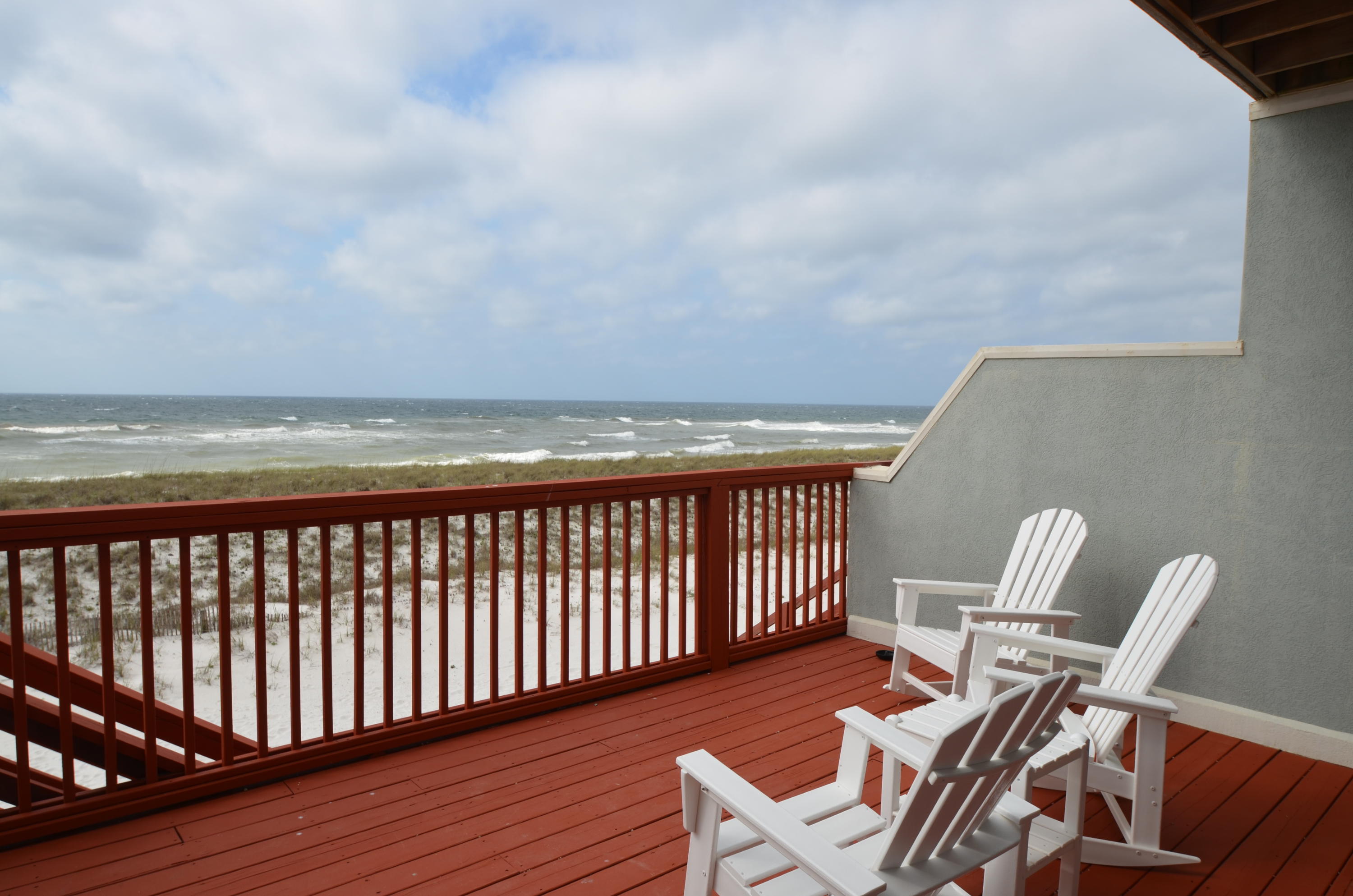 Only 3 miles from USA Today's #1 rated beach! Enjoy the sunrise and sunset from either second or third floor full balconies. Newly updated with carpet, tile, granite countertops, cabinets and stainless steel appliances in the kitchen. Also, top grade, high impact windows and sliding glass doors installed 2016. Ground level has 2 tandem parked car spaces inside the blow-out-wall garage with front entry by single overhead door. Property is elevated approximately 16 ft above ground lvl on ground pilings. Beach Restoration System is completed with approximately 16 ft high berm and planted with sea oats. Second level has a spacious great room that opens to the balcony with stairs to the beach, an eat in kitchen and full bath. Master bed/bath and 2 additional bedrooms on 3rd Level.