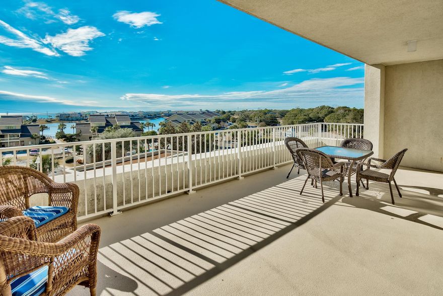 This is a must-see 2 bedroom unit with one of the nicest extended and open balconies that only the 4th floor provides! These units are solid rental properties with the same plans doing around $30,000 in gross rentals. Very few buildings offer what Ariel Dunes II brings to the table. Fantastic views of the Gulf, panoramic views of Destin, numerous amenities, and updated construction are just a few to mention! This 4th floor unit offers nice views of the Gulf, lake, and the night lights of Destin! The unit features: 9 foot ceilings, relaxed beach cottage dcor, ceramic tile in all areas except the bedrooms making it great for rental maintenance, granite kitchen counter tops, stainless steel appliances, and an outside storage unit you only get in Ariel Dunes II. Enjoy the large balcony...