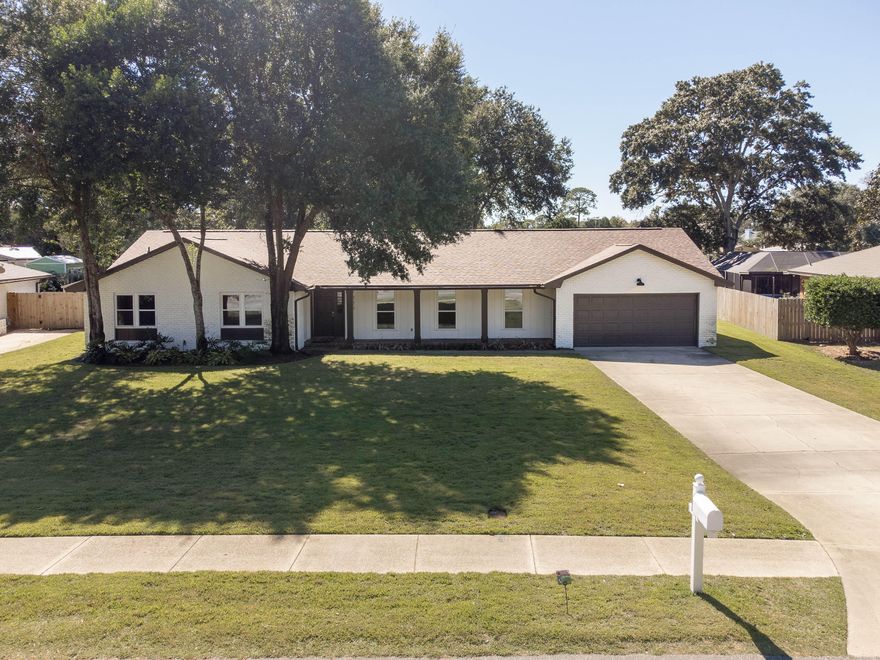 Come and enjoy a completely renovated home in one of the most sought-after streets in Fort Walton Beach. This area boasts close proximity to the boat ramps, Ferry Park Uptown Station, the Yacht Club, and it is easy to golf cart through the streets to downtown while avoiding the traffic! The remodel of this home features a new kitchen with quartz countertops with a waterfall edge, stainless appliances, a farmhouse sink, and undermount lighting. It has an incredibly huge backyard, and there is a guest bedroom that is split from the other bedrooms. The house has a new roof (2021), new electrical (2021), new windows (2021), new water heaters (2021), fresh paint exterior/interior (2021), privacy fence (2020) landscaping & sod (2021).