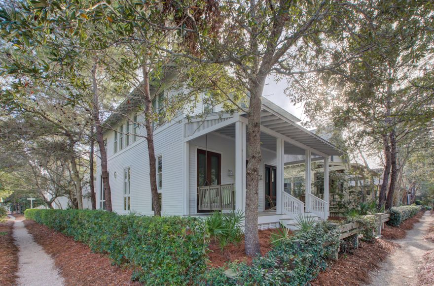 This professionally decorated, fully furnished home features an airy contemporary coastal design throughout. Ideally located on a large corner lot in WaterColor's Phase I Park District, this property is just steps to the WaterColor Beach Club and town center. This thoughtfully designed home offers a main residence and a detached carriage house with 2 car garage and separate living quarters above. The main home features hardwood flooring throughout, a spacious great room with soaring ceilings, floor to ceiling windows, a cozy fireplace, large dining, gaming area and kitchen with ample storage that opens to the screened in outdoor dining area,. The second level is highlighted by two spacious master suites with private baths, an additional bedroom and a full bathroom. The carriage house